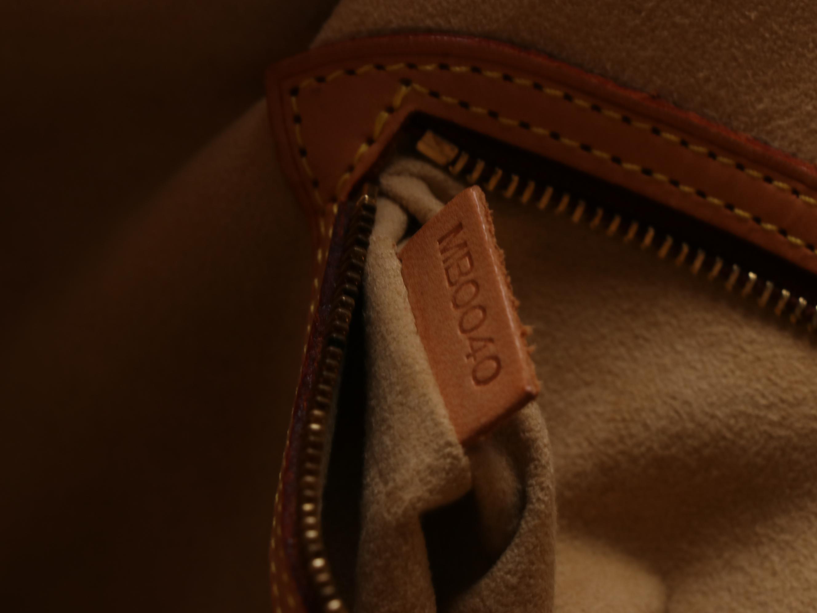 Louis Vuitton Babylone Bag in Monogram Canvas and Leather