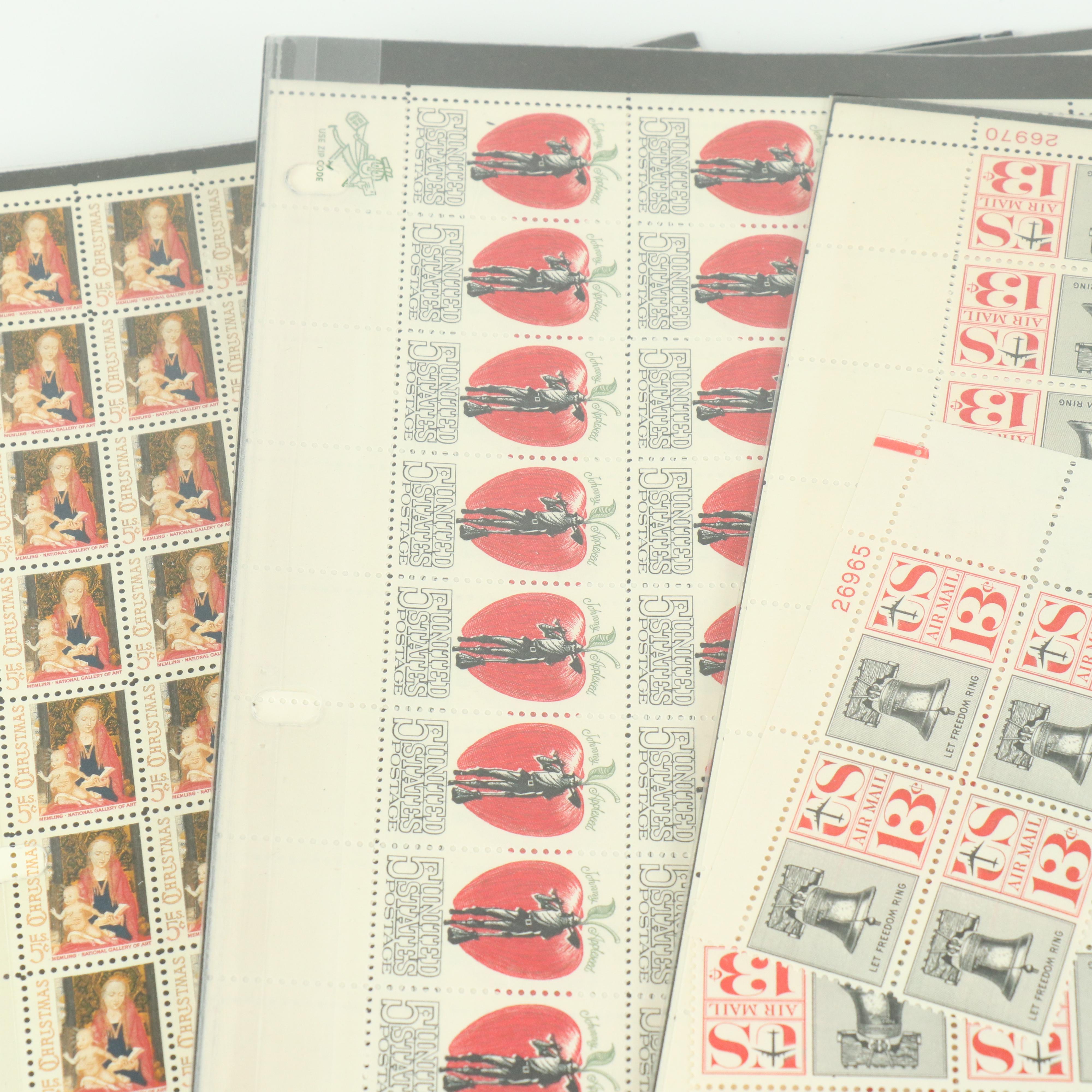 Fifty-Seven Vintage U.S. Postage Stamp Sheets