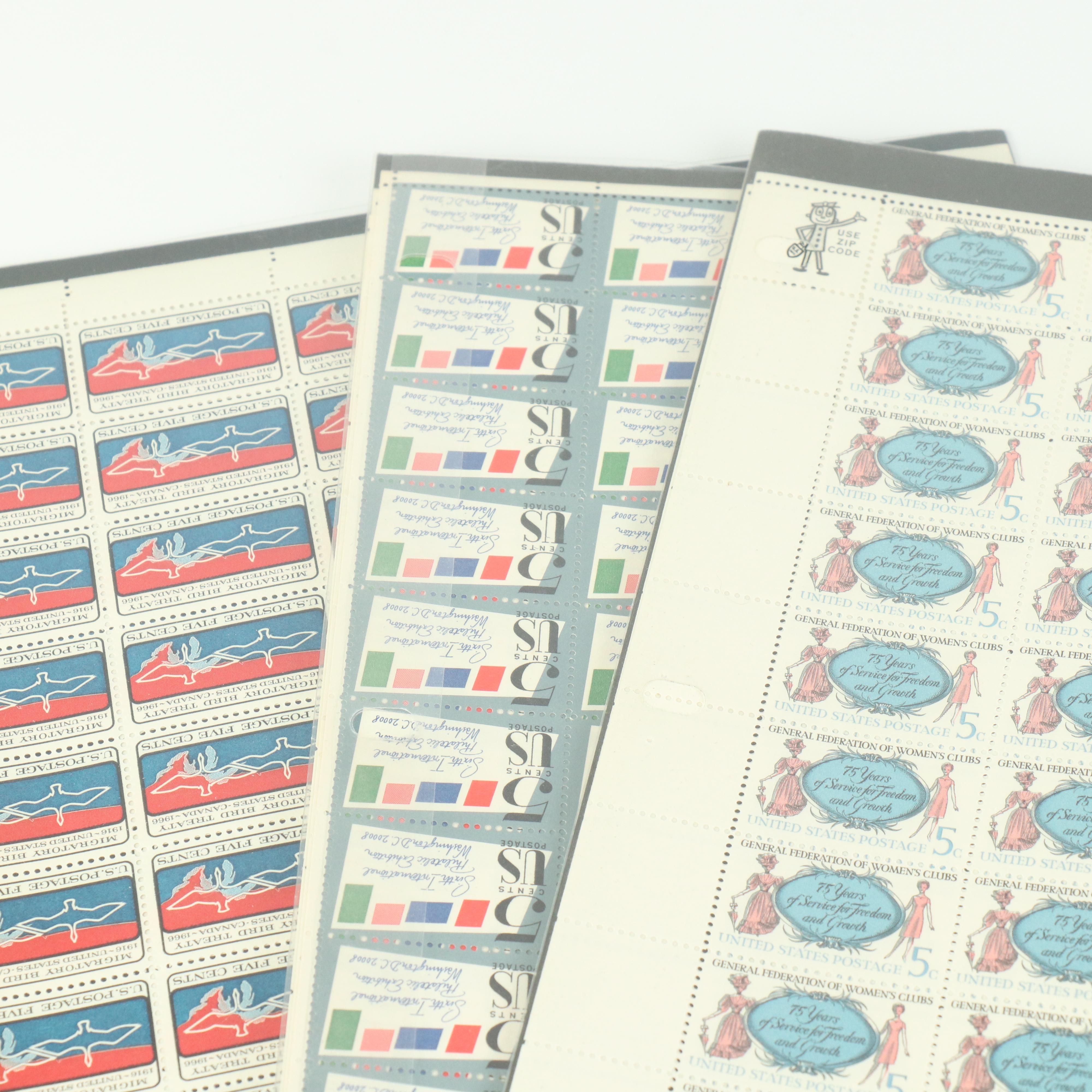 Fifty-Seven Vintage U.S. Postage Stamp Sheets