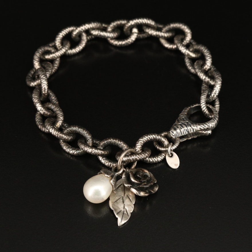Sterling Charm Bracelet Including Pearl, Flower and Foliate Charms