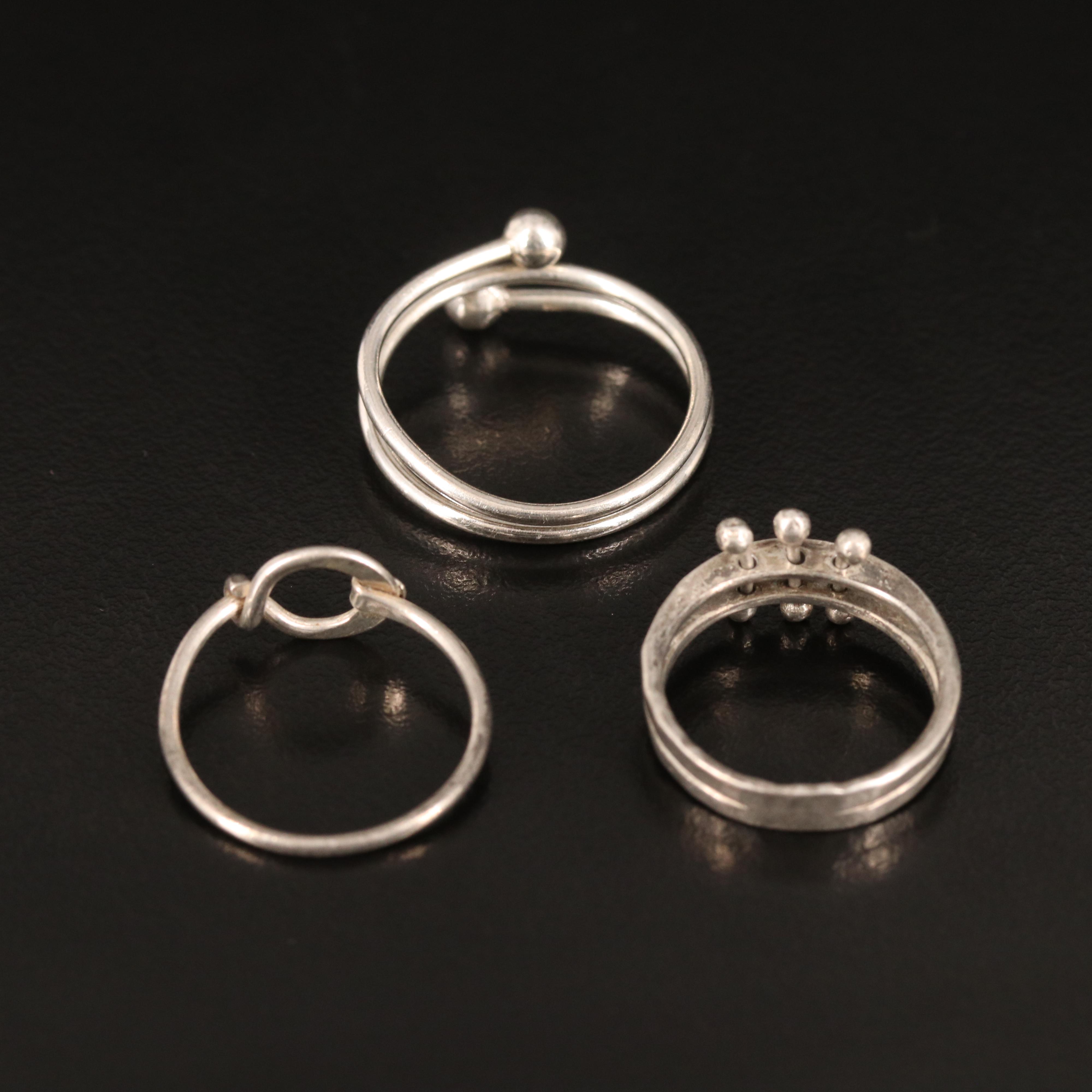 Trio of Geometric Rings