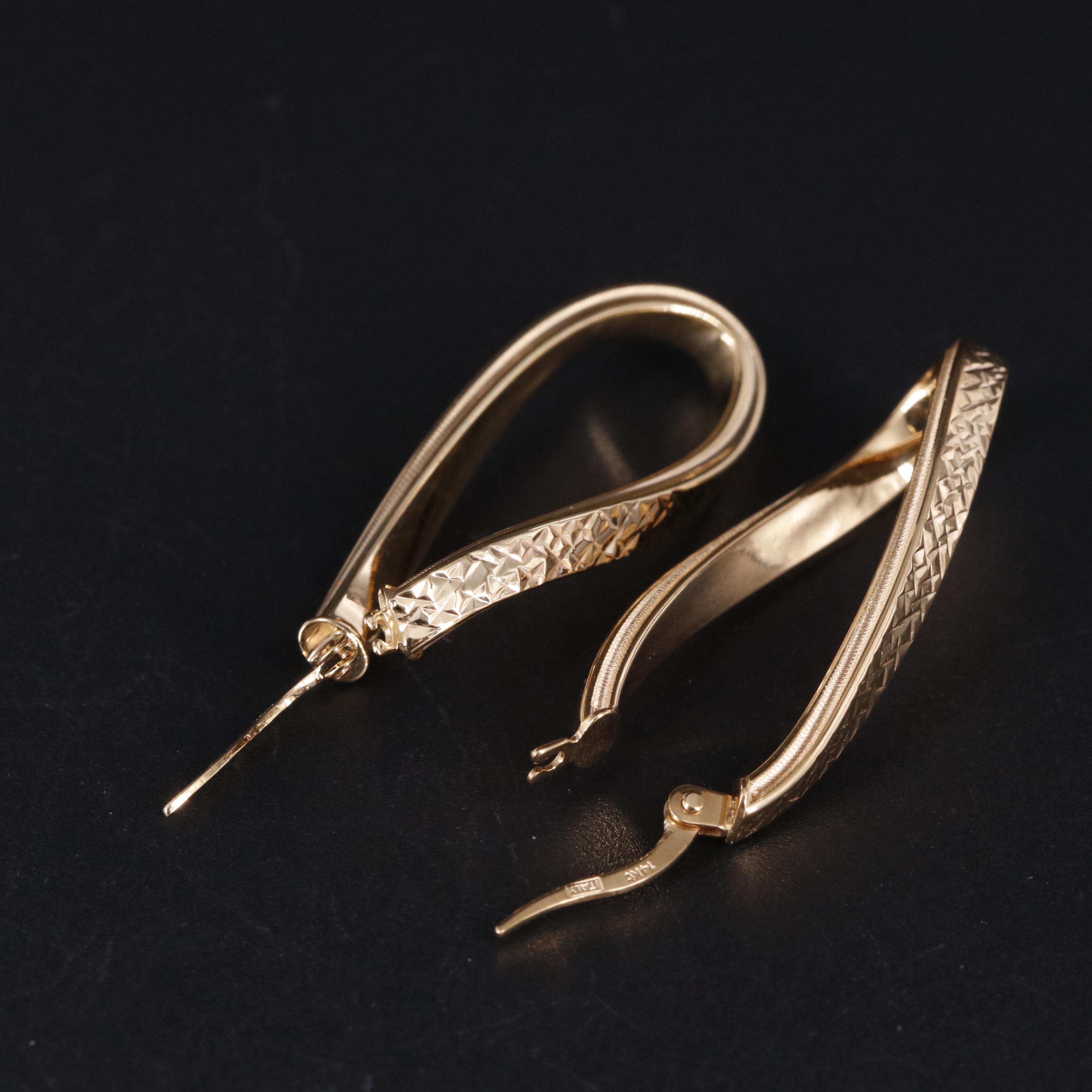 14K Twisted Oval Latch Back Hoop Earrings