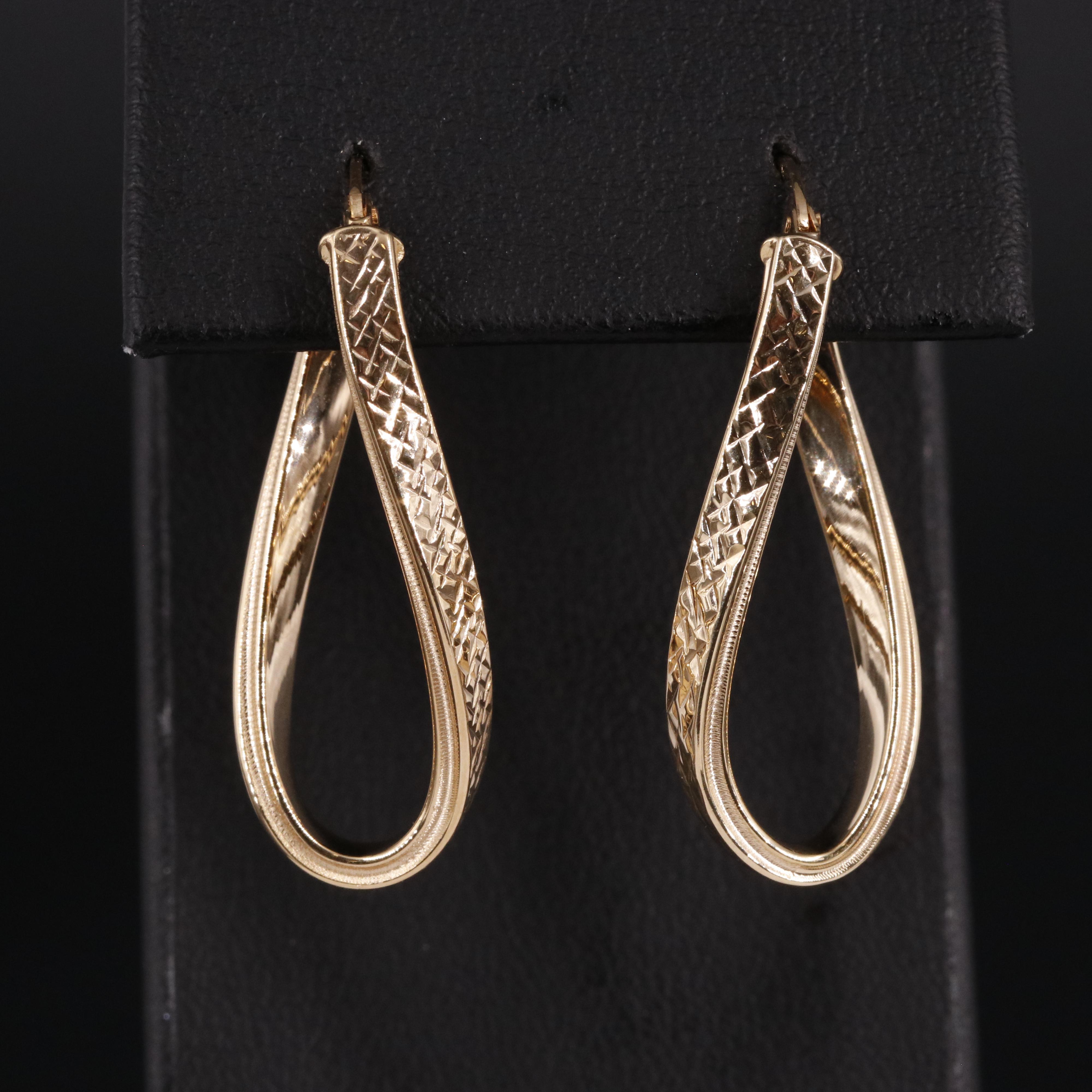 14K Twisted Oval Latch Back Hoop Earrings