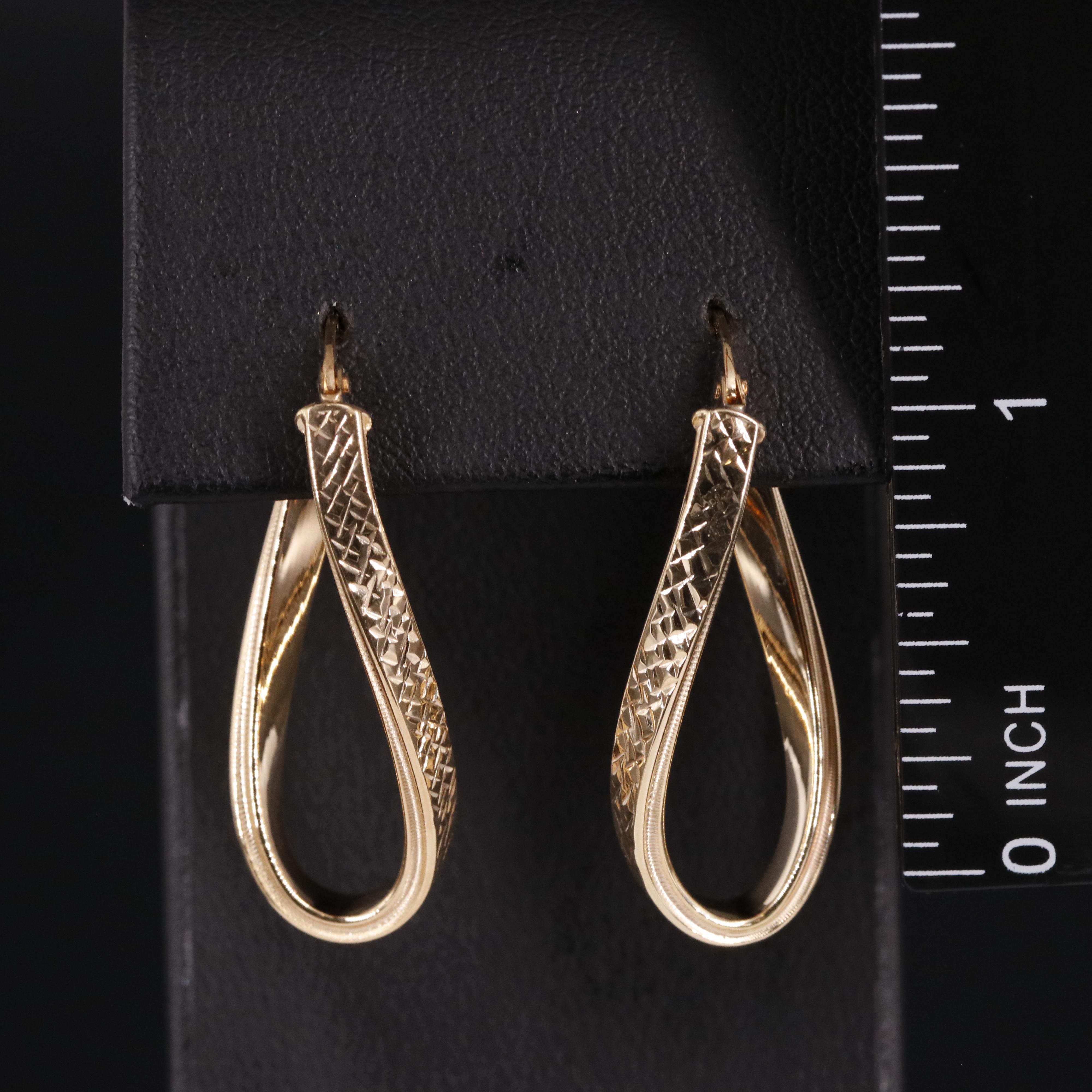 14K Twisted Oval Latch Back Hoop Earrings