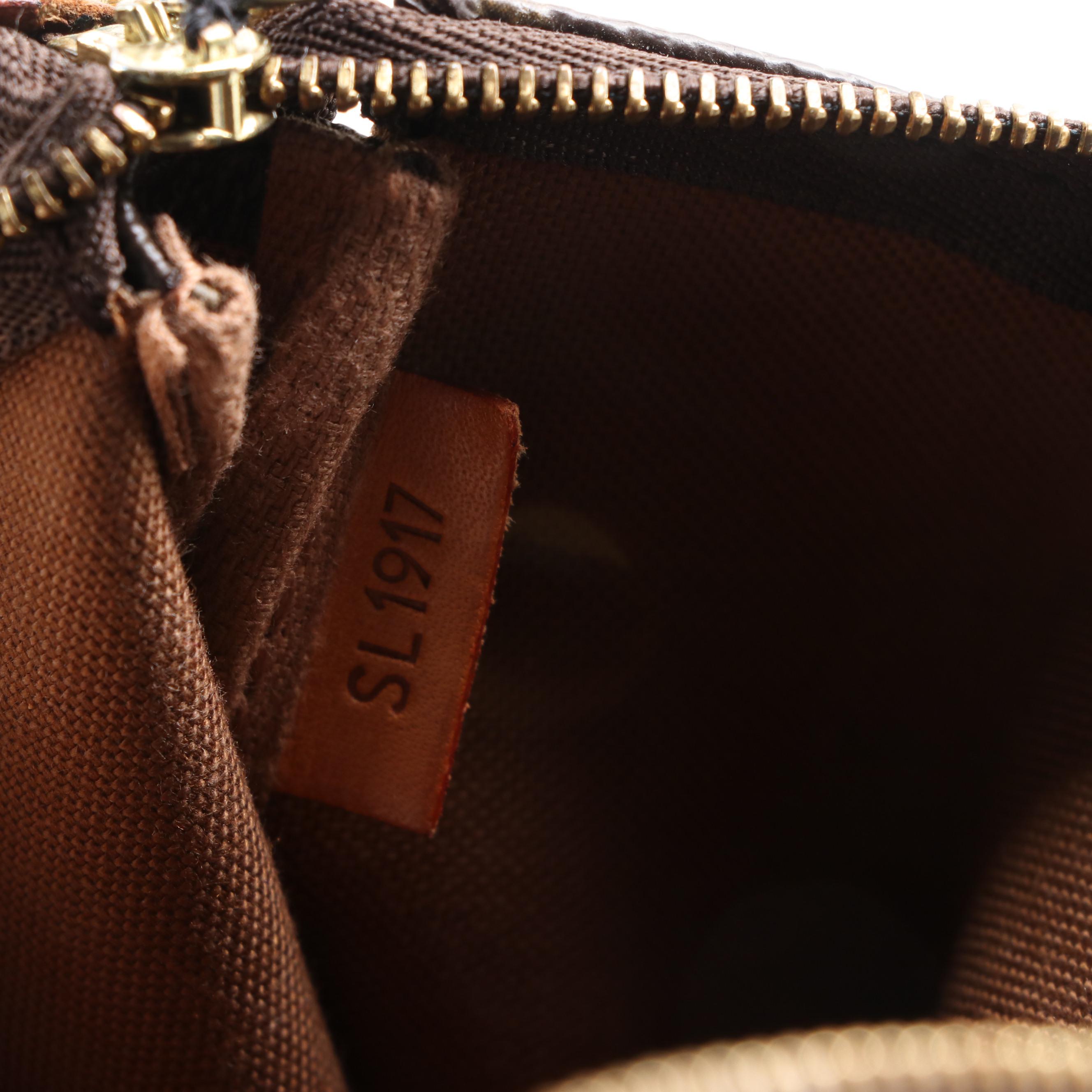 Louis Vuitton Pochette Accessories in Monogram Canvas and Vachetta Leather