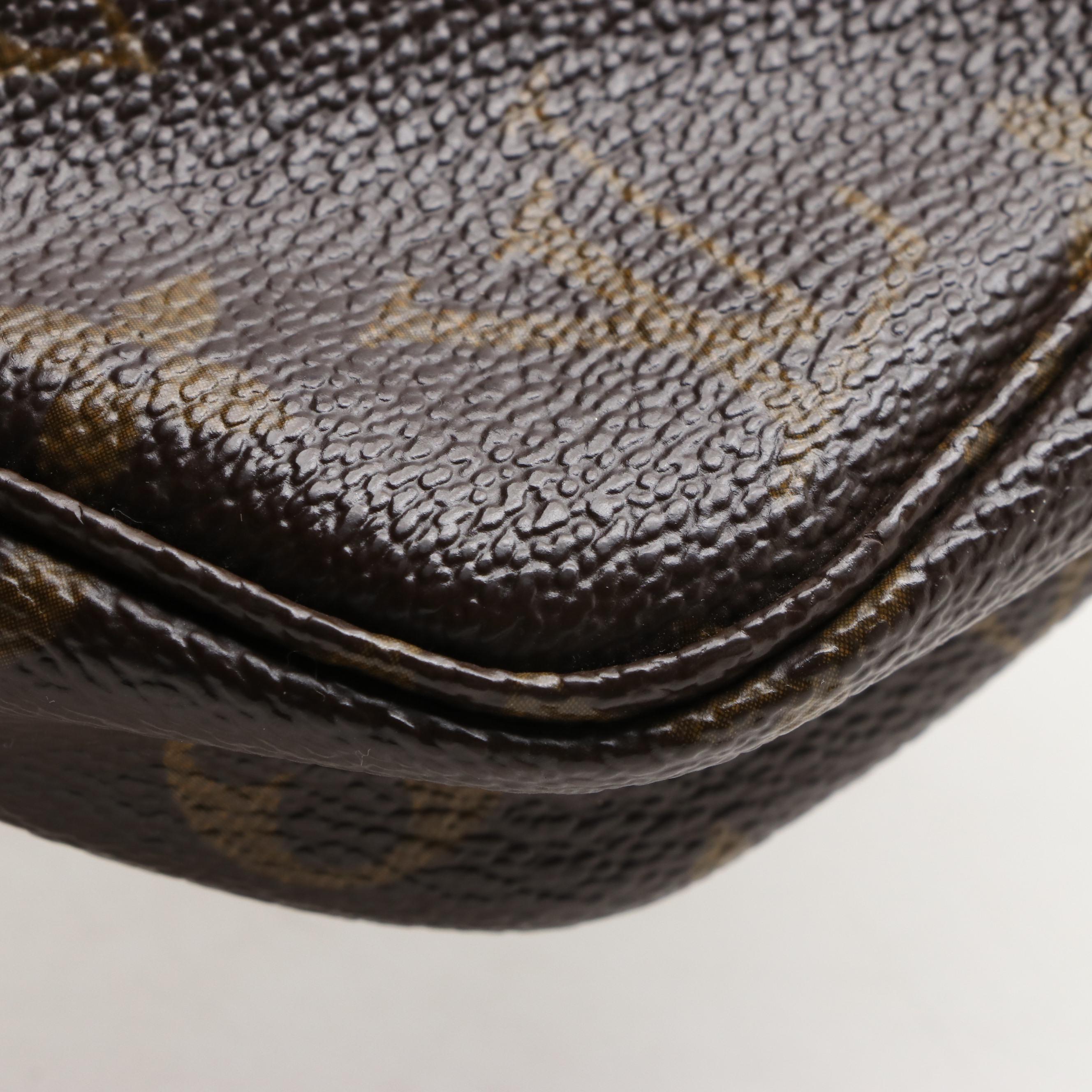 Louis Vuitton Pochette Accessories in Monogram Canvas and Vachetta Leather