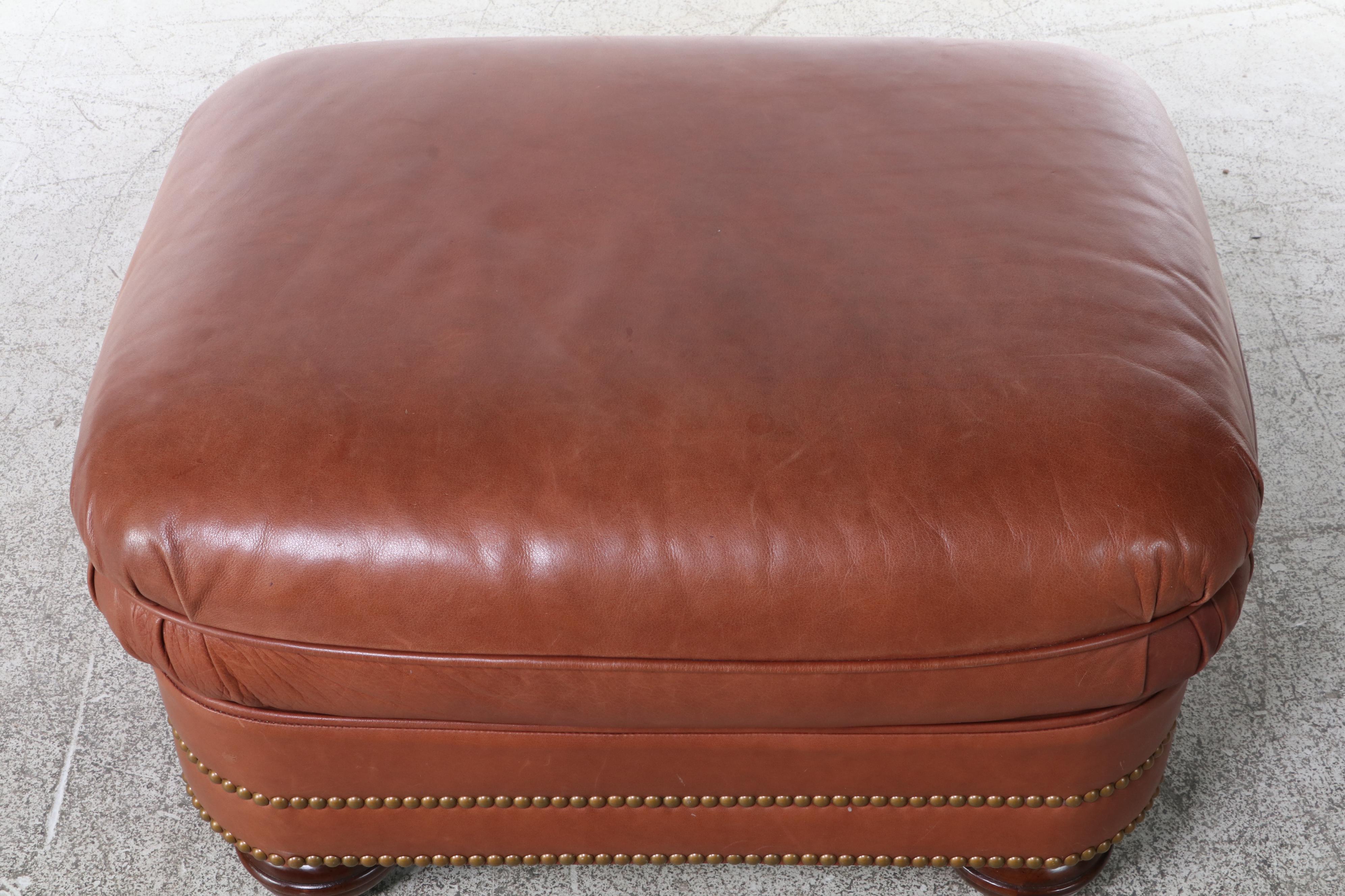 Century Leather and Brass-Tacked Armchair and Leathercraft Ottoman
