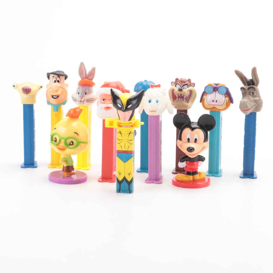 PEZ Dispensers and Bobbleheads Including "The Peanuts" and More