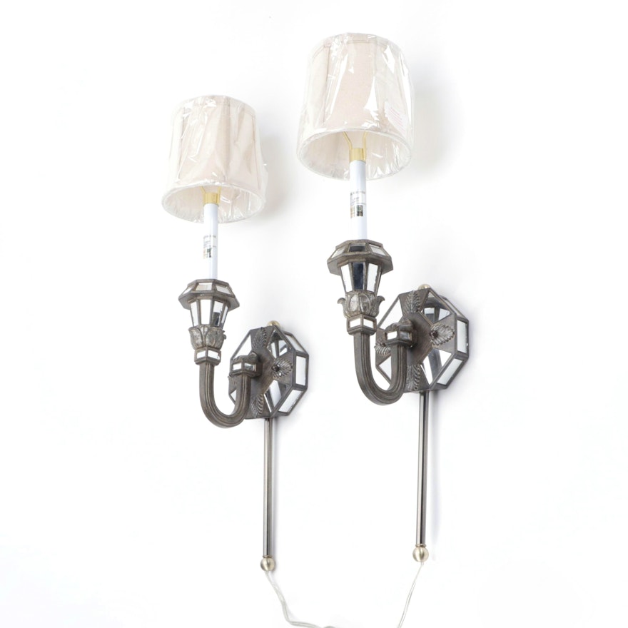 Pair of Patinated Cast Composite and Mirror Inset Wall Sconces