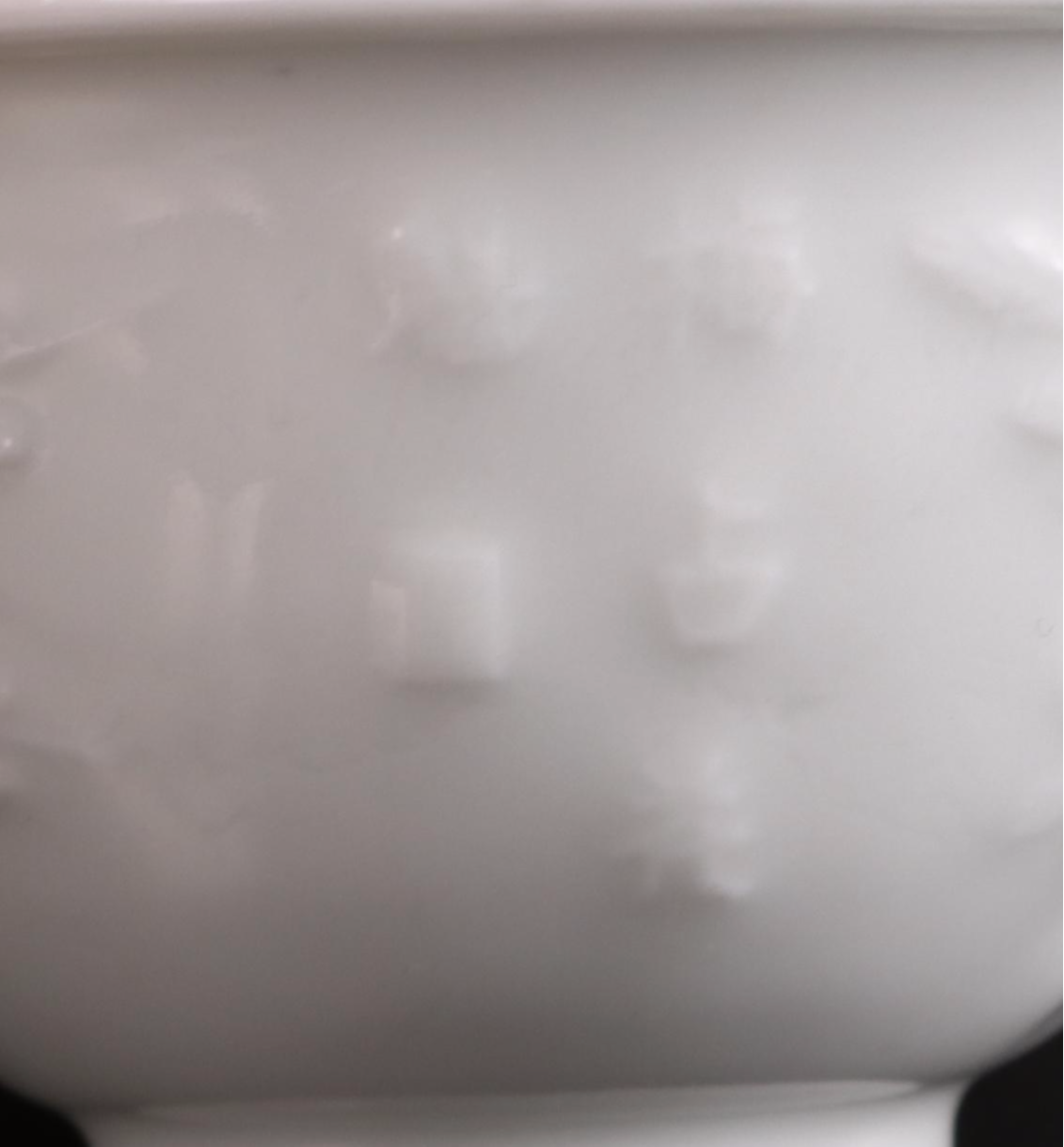 Pair of Chinese Embossed Porcelain Tea Bowls