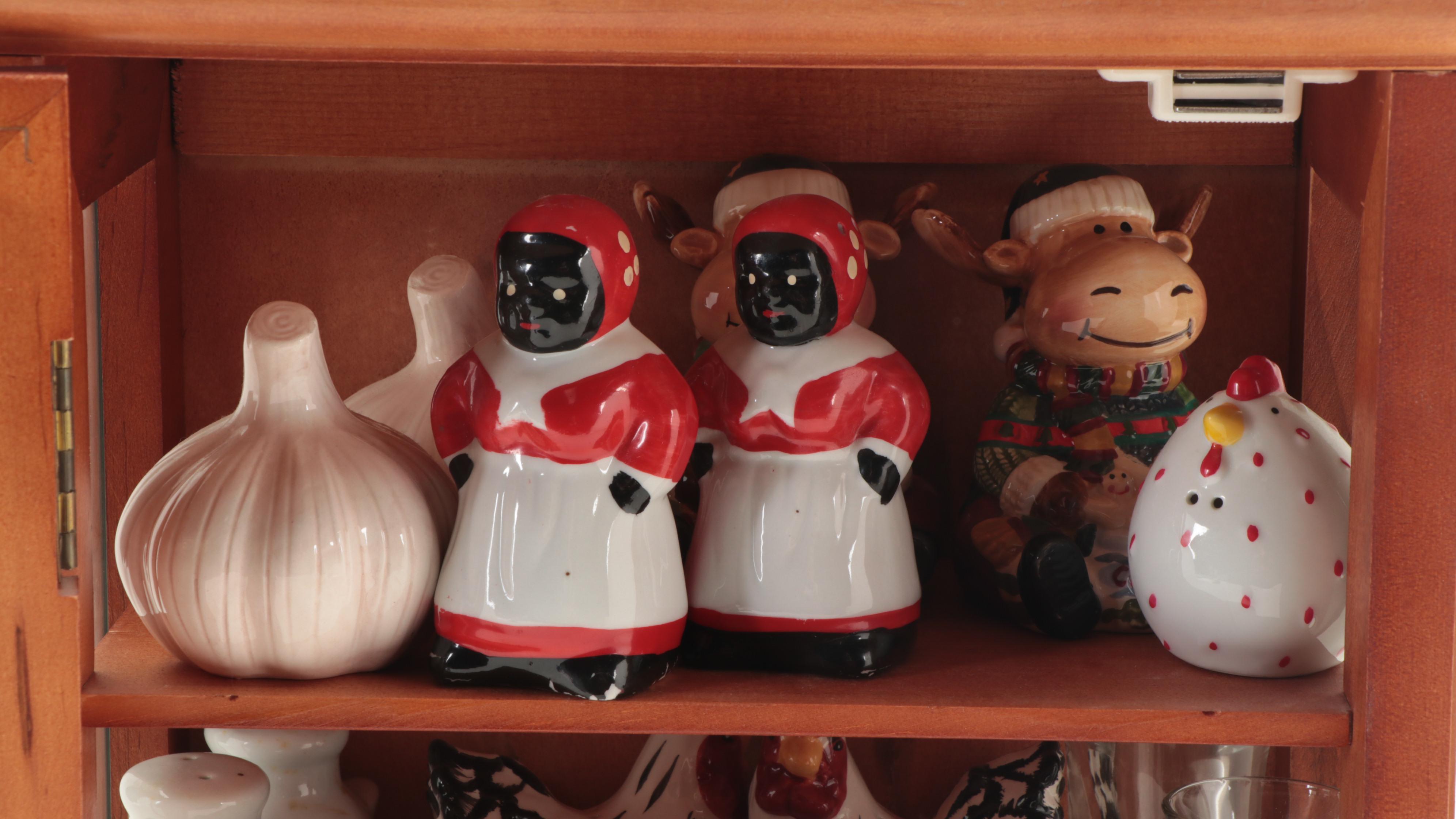 Souvenir Shot Glasses and Shakers in Wall Display Cabinet