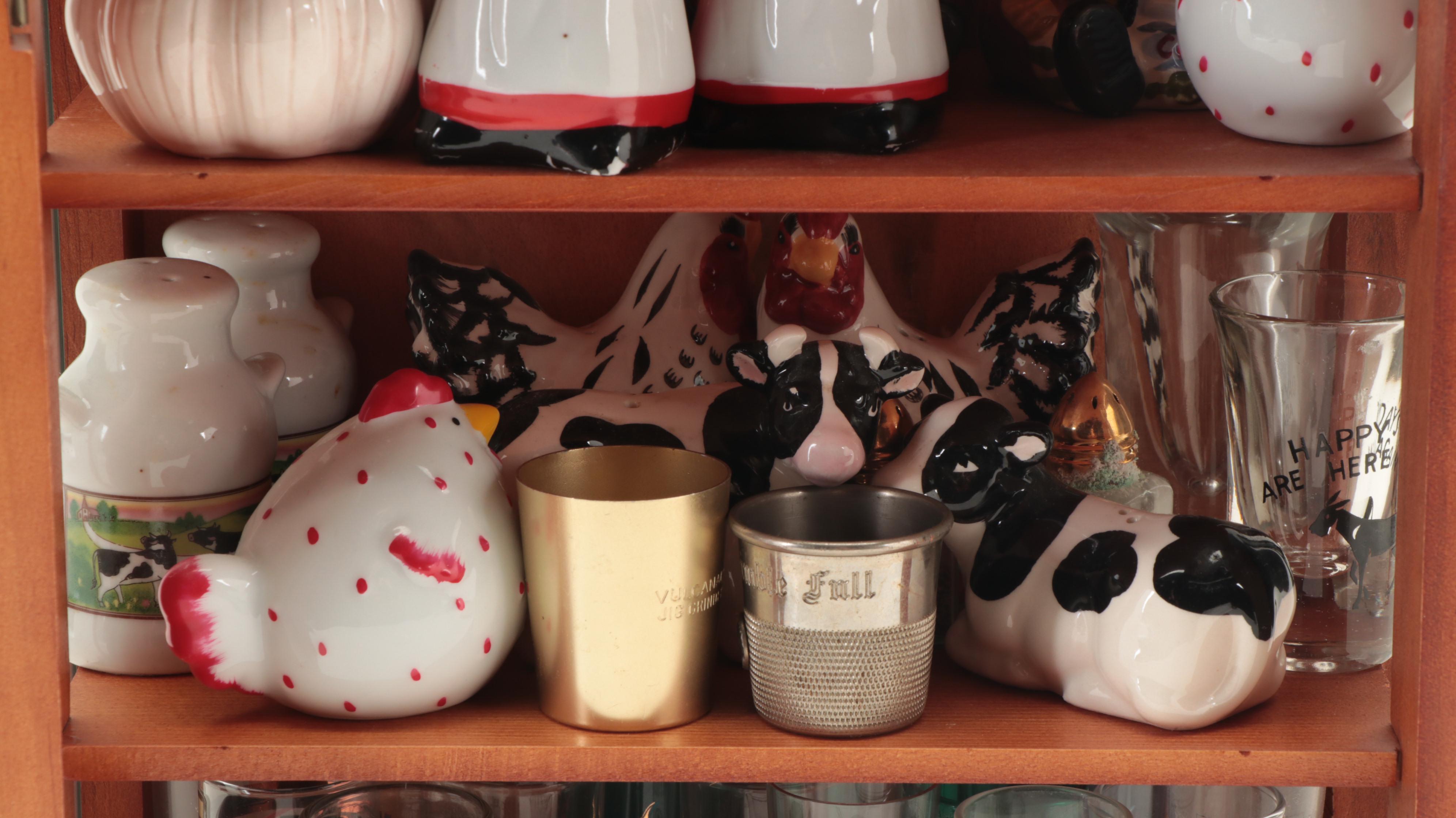 Souvenir Shot Glasses and Shakers in Wall Display Cabinet
