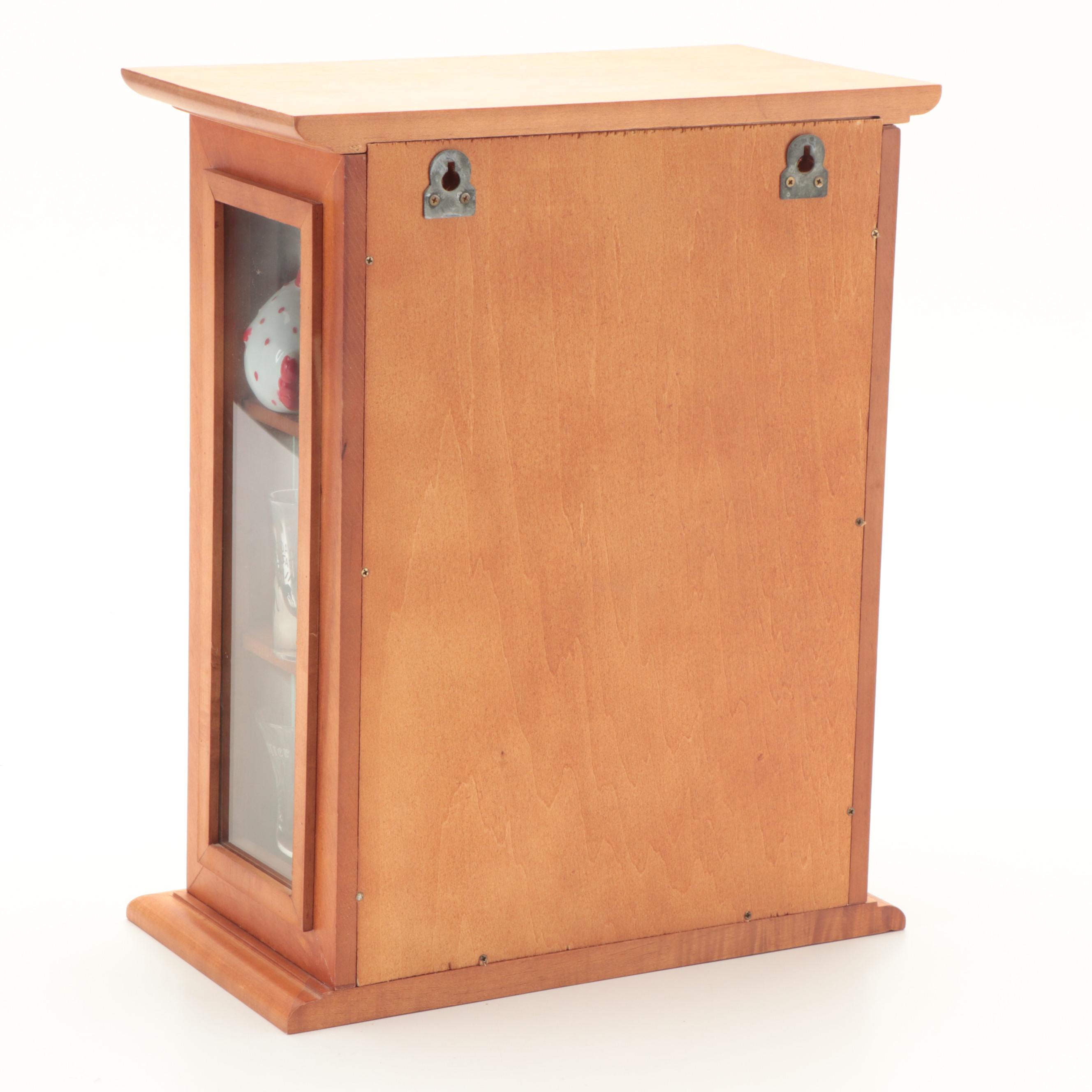 Souvenir Shot Glasses and Shakers in Wall Display Cabinet