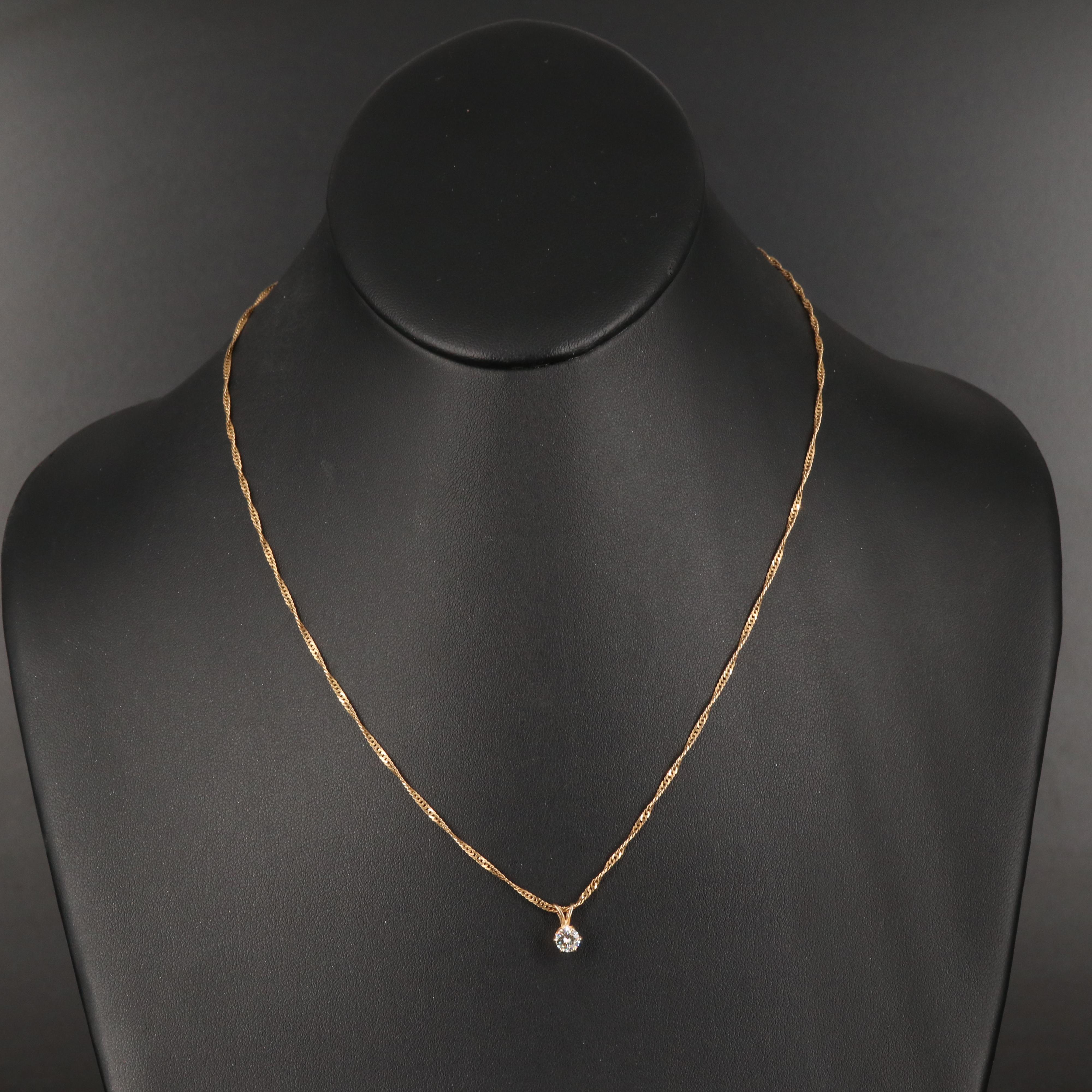 0.38 CT Diamond Solitaire Pendant on Singapore Chain Necklace in 14K