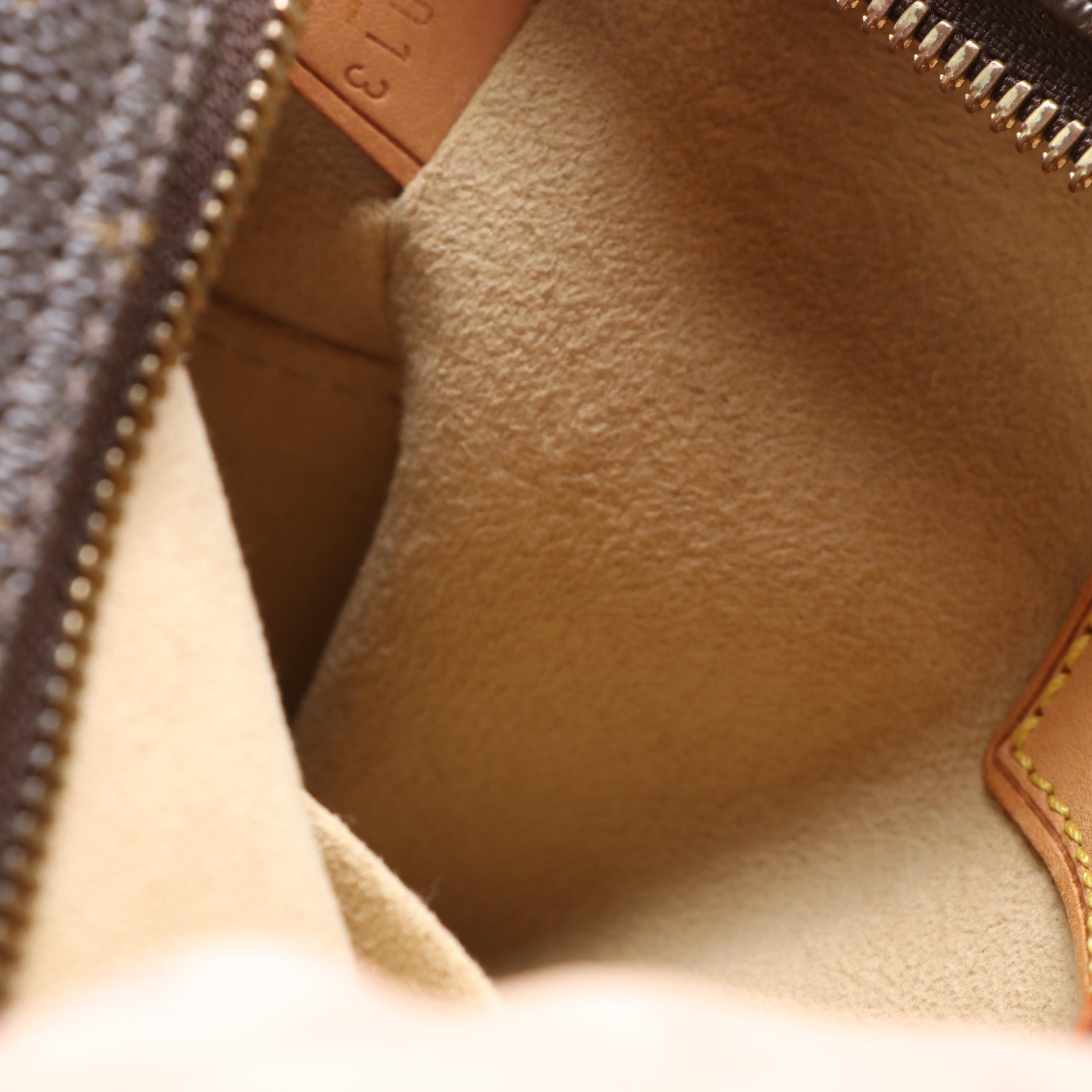 Louis Vuitton Cité GM Shoulder Bag in Monogram Canvas and Vachetta Leather