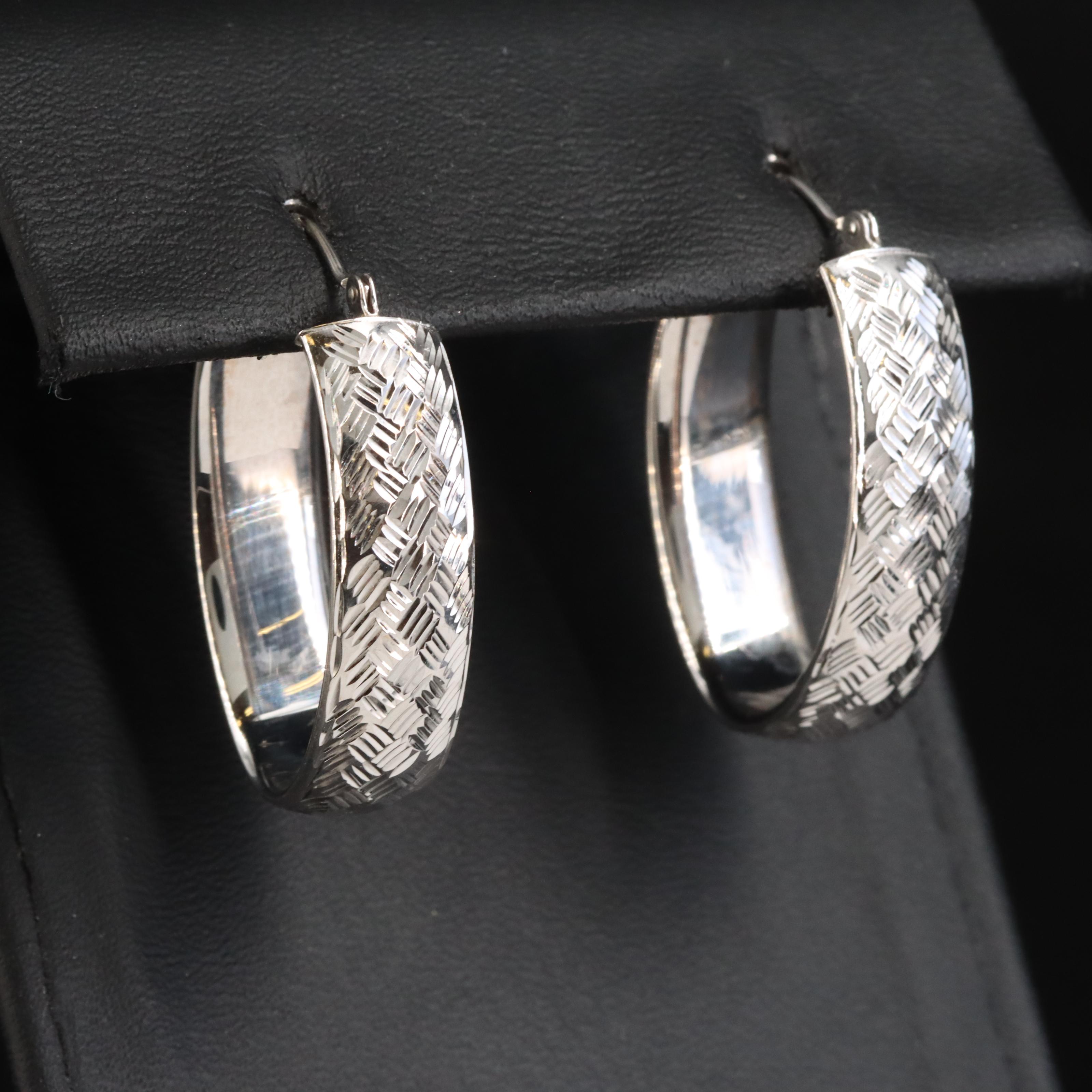 14K Elongated Hoop Earrings with Diamond Cut Finish