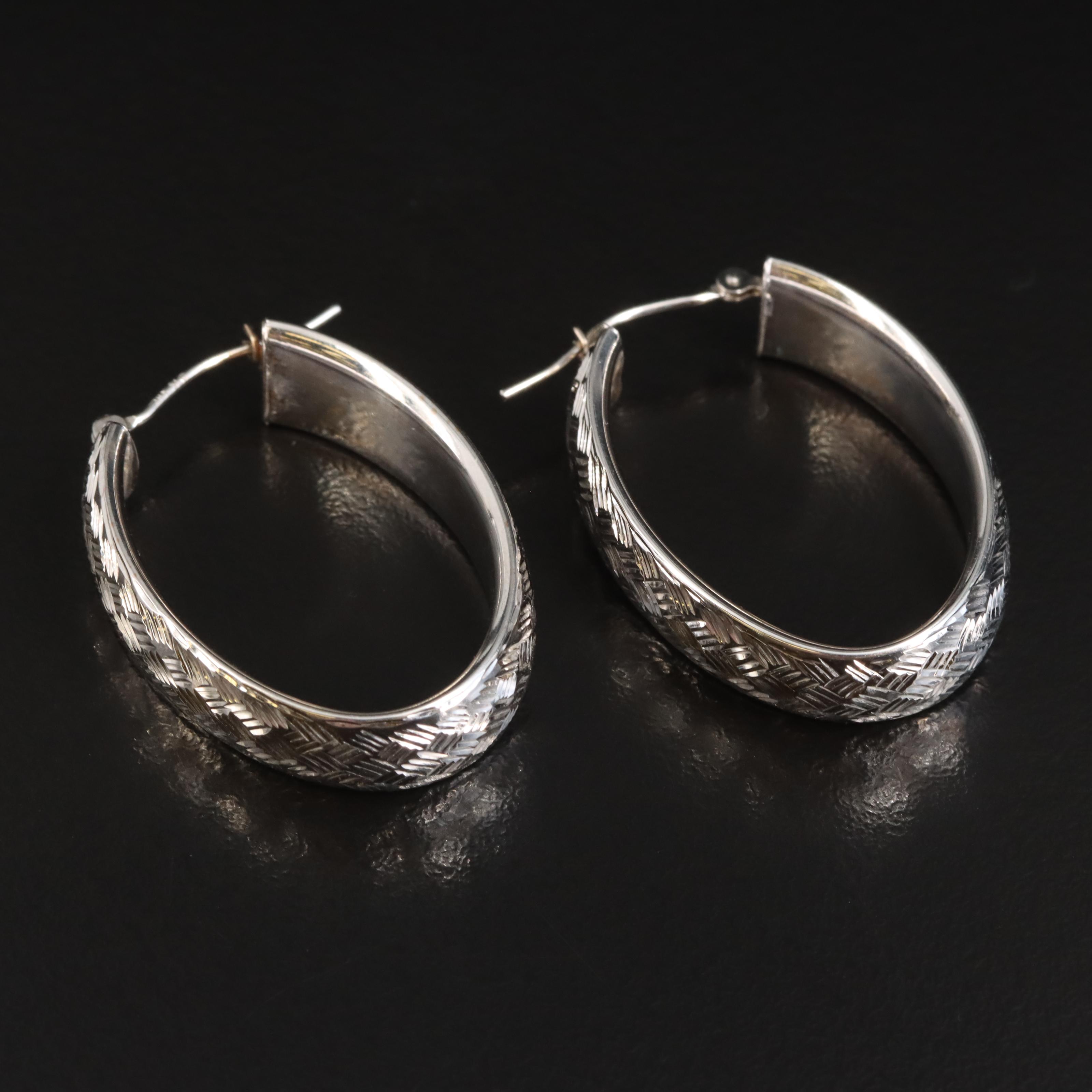 14K Elongated Hoop Earrings with Diamond Cut Finish