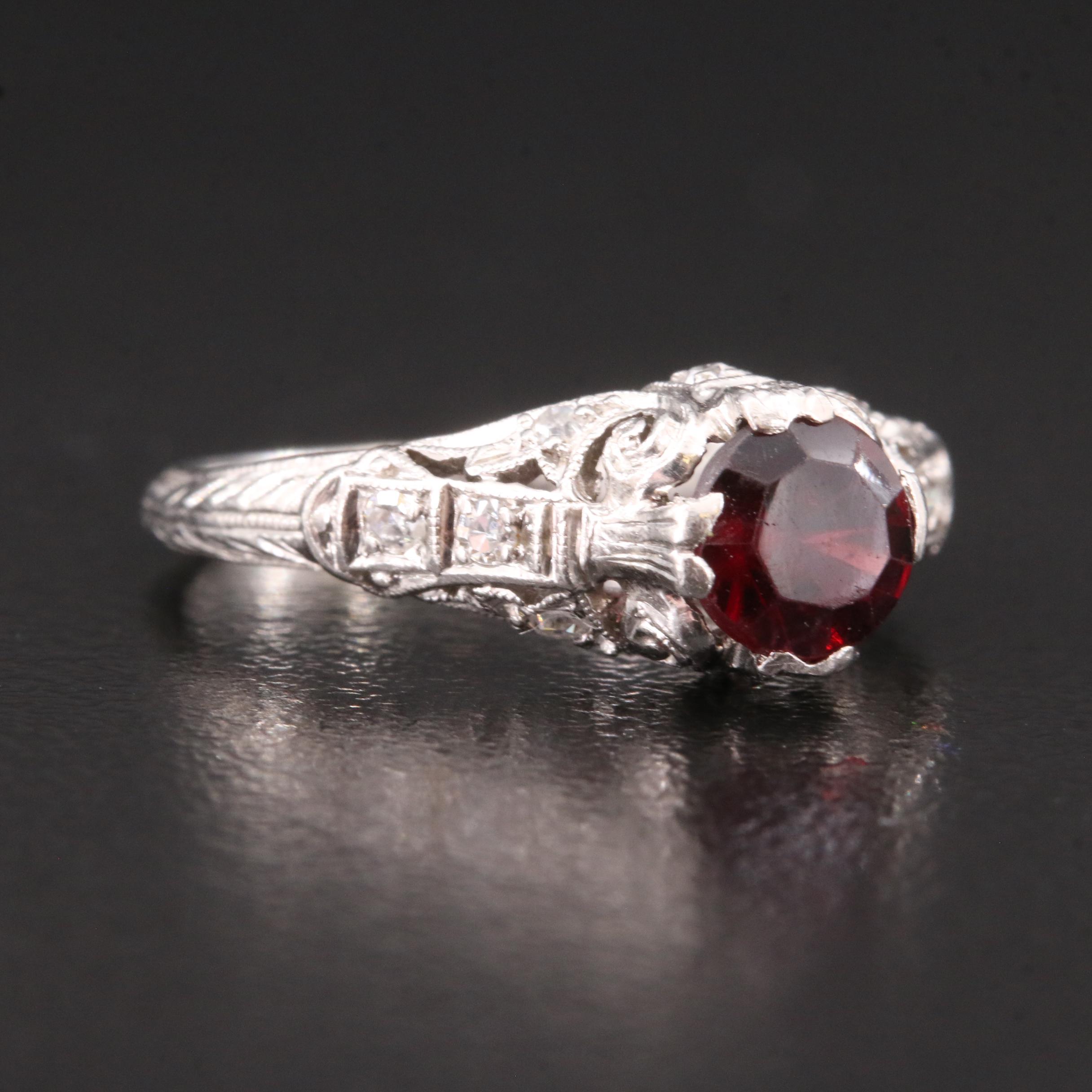 Vintage Platinum Garnet and Diamond Scrollwork Ring