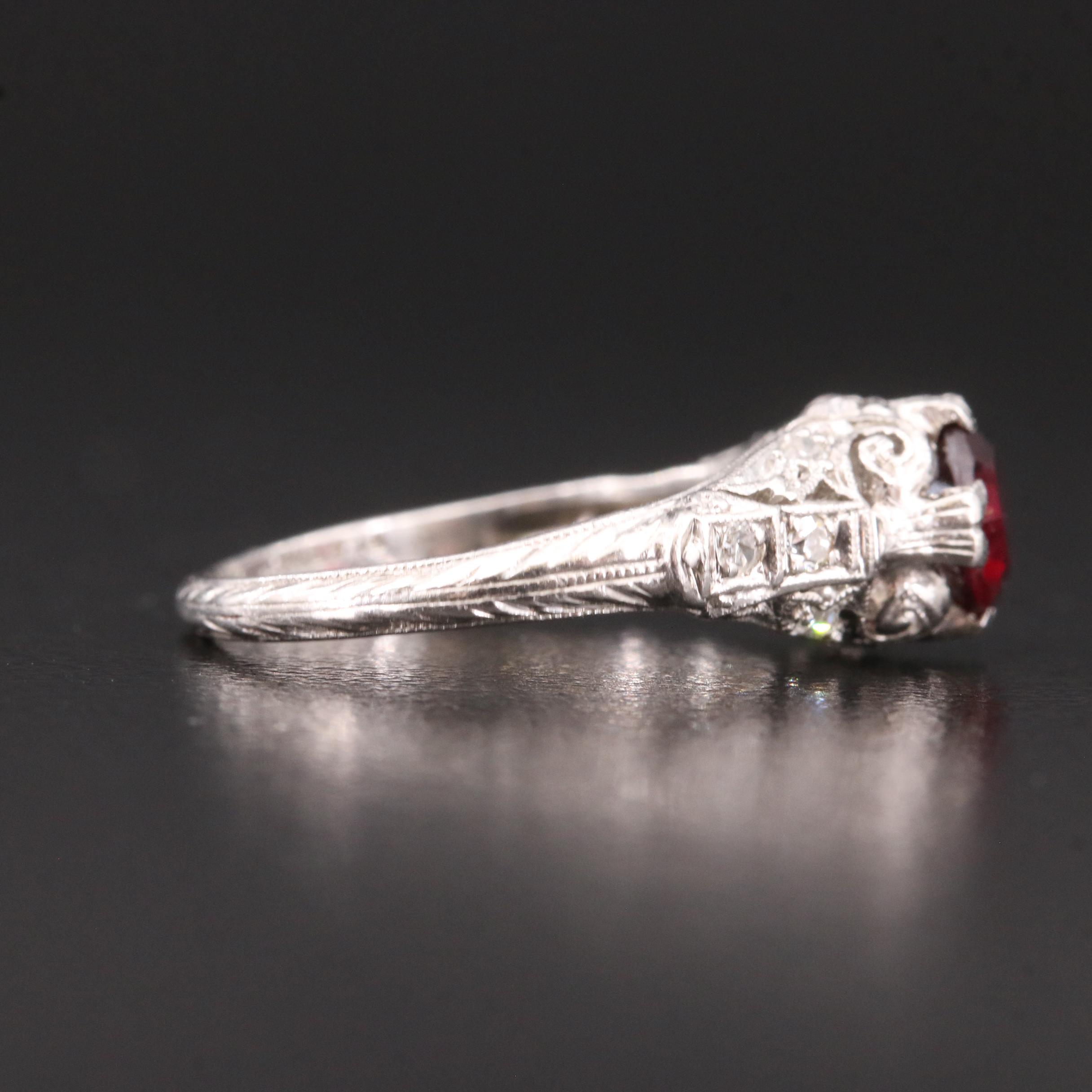 Vintage Platinum Garnet and Diamond Scrollwork Ring