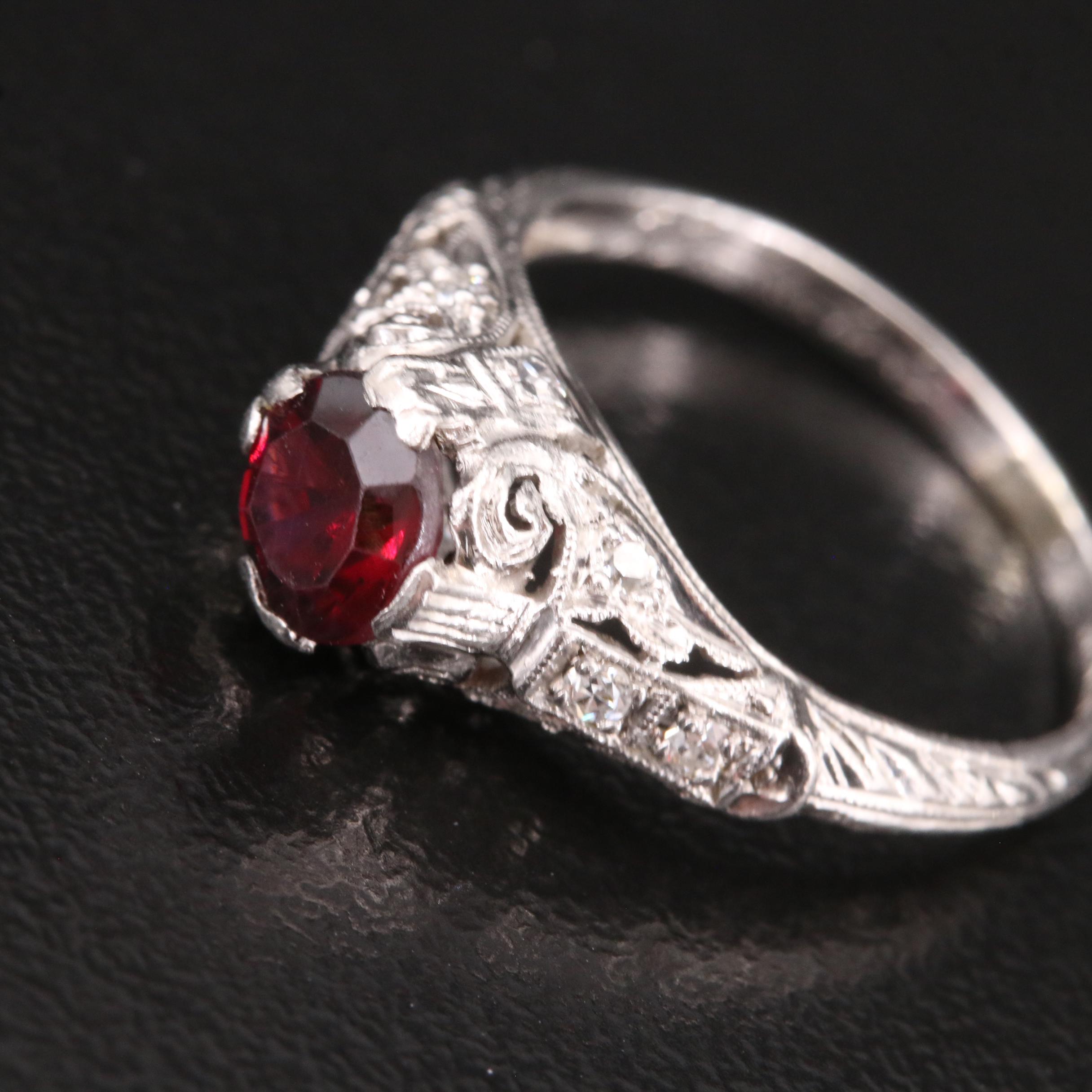 Vintage Platinum Garnet and Diamond Scrollwork Ring
