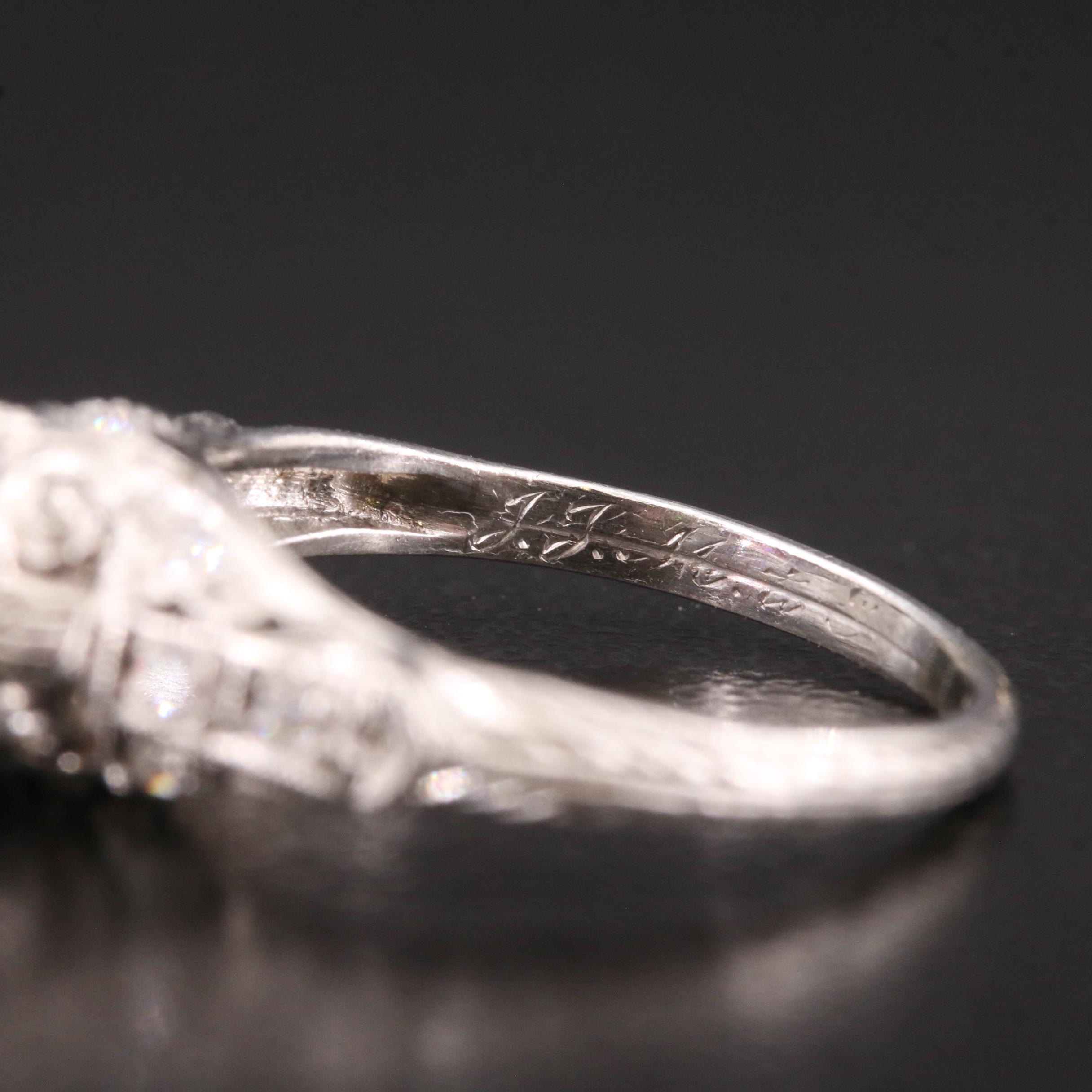 Vintage Platinum Garnet and Diamond Scrollwork Ring