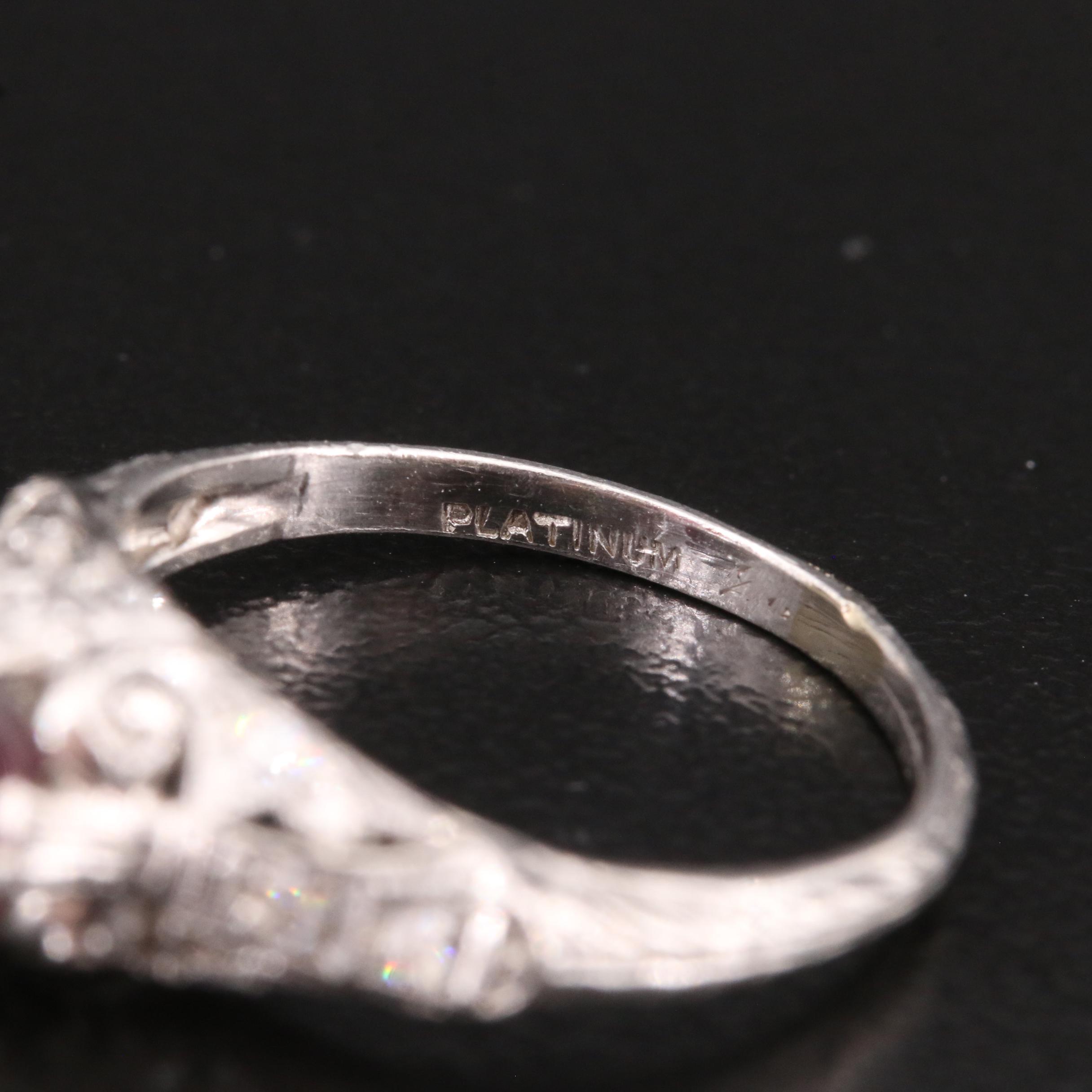 Vintage Platinum Garnet and Diamond Scrollwork Ring