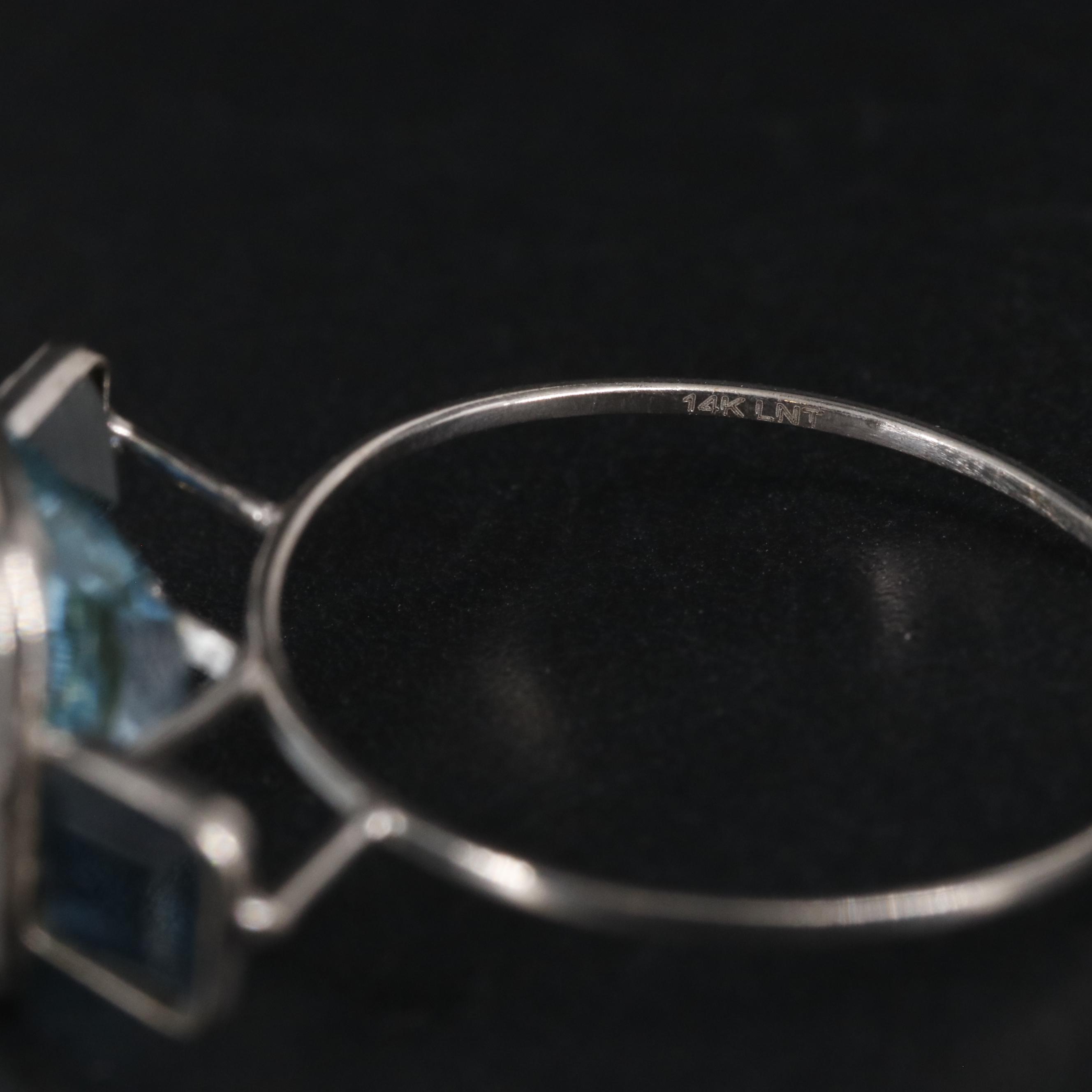 14K 4.28 CTW Topaz and Sapphire Ring