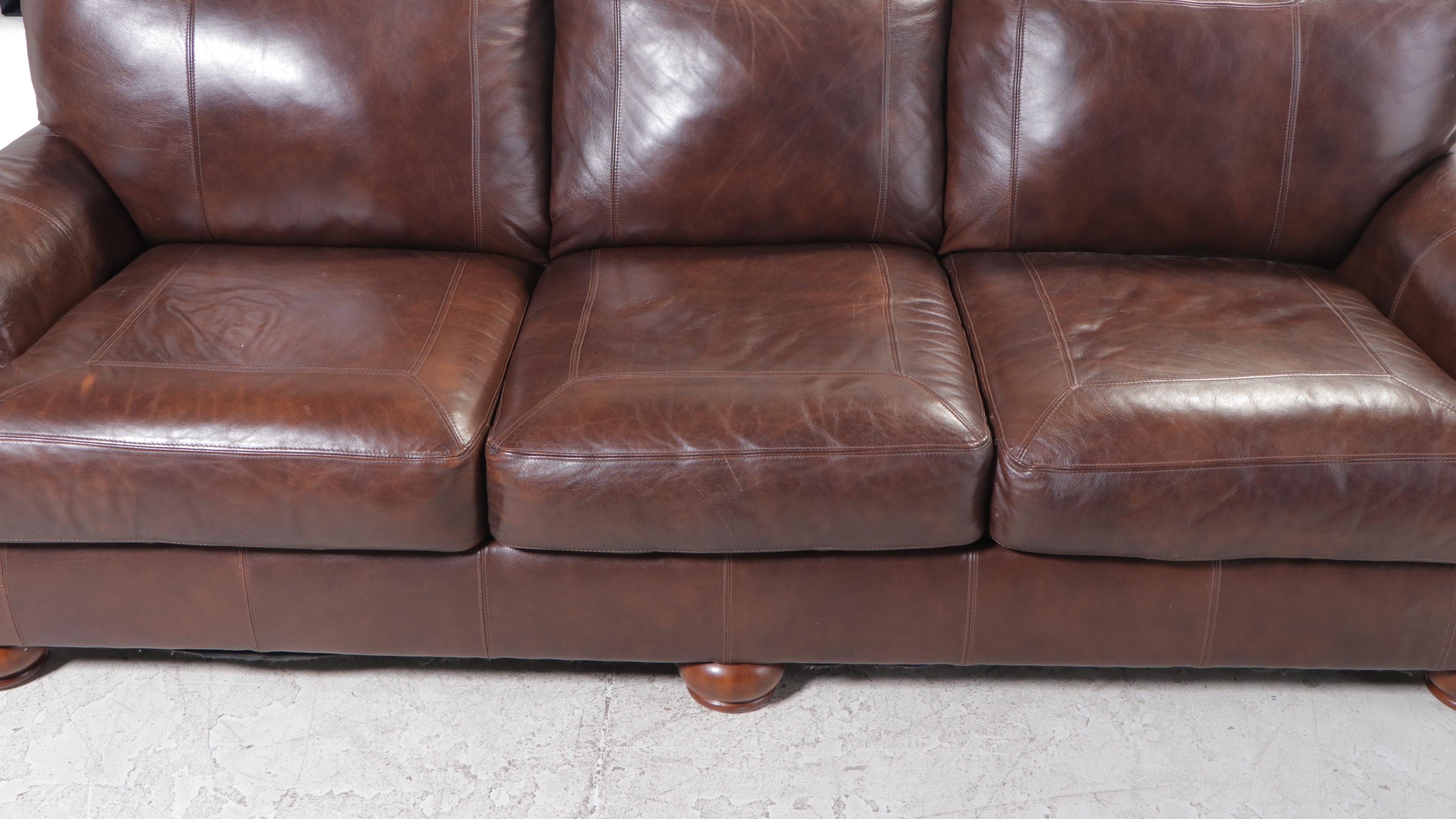 Ashley Furniture Brown Leather Roll-Arm Sofa