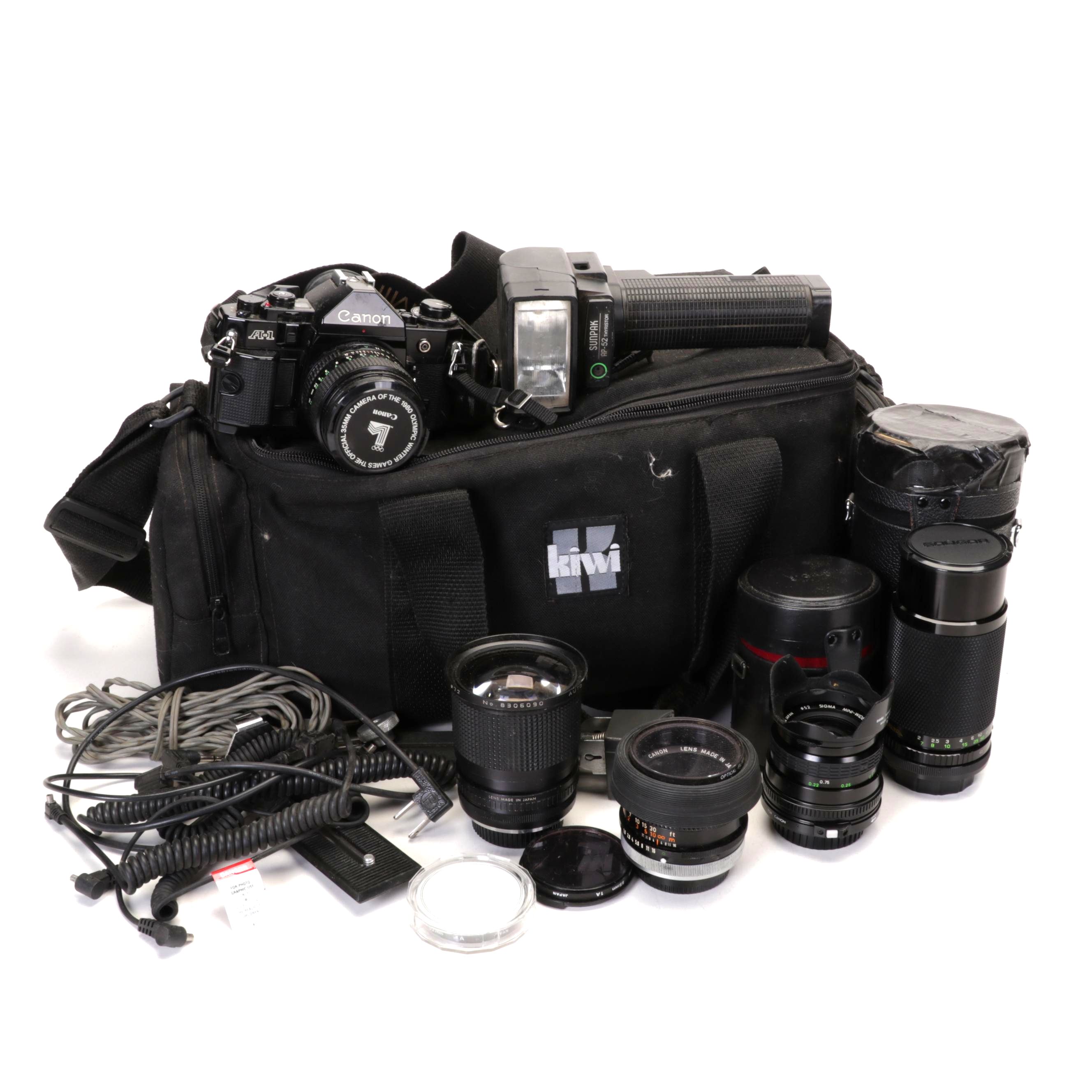 Canon A-1 Camera, Lenses, Kiwi Case, and More Accessories