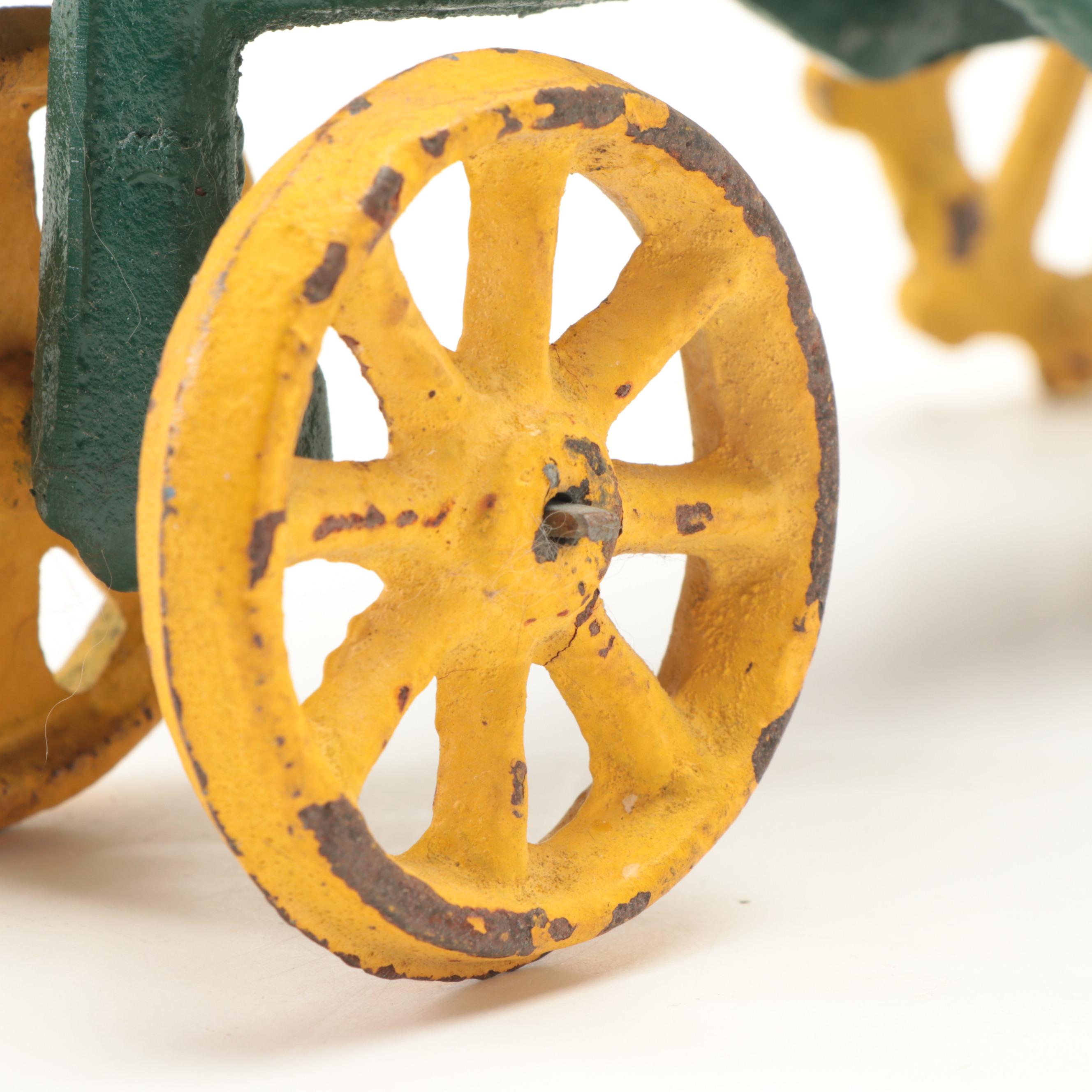 Painted Cast Iron John Deere Tractor Toy