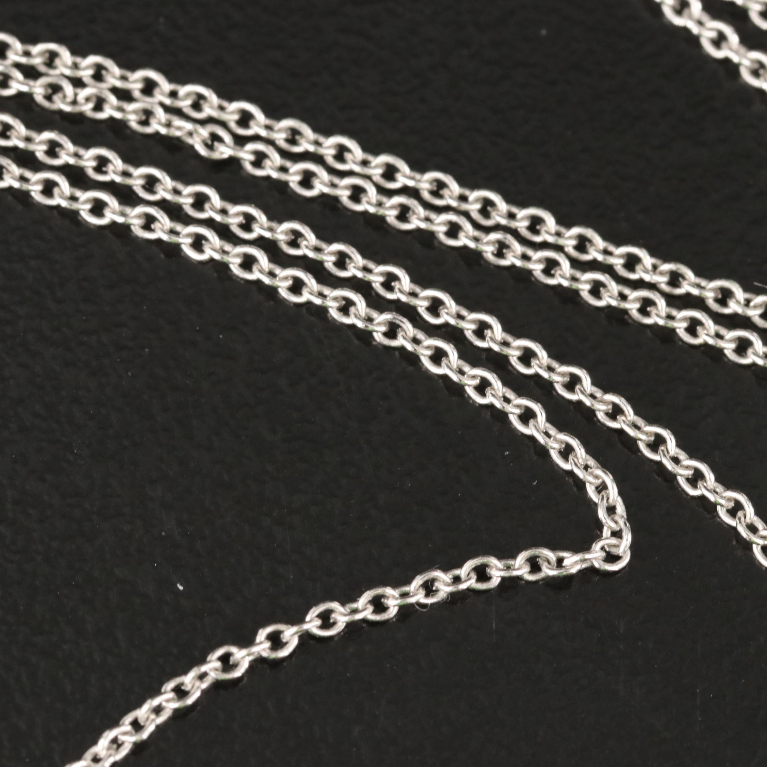 Platinum Ruby and Diamond Star Pendant on 10K Chain