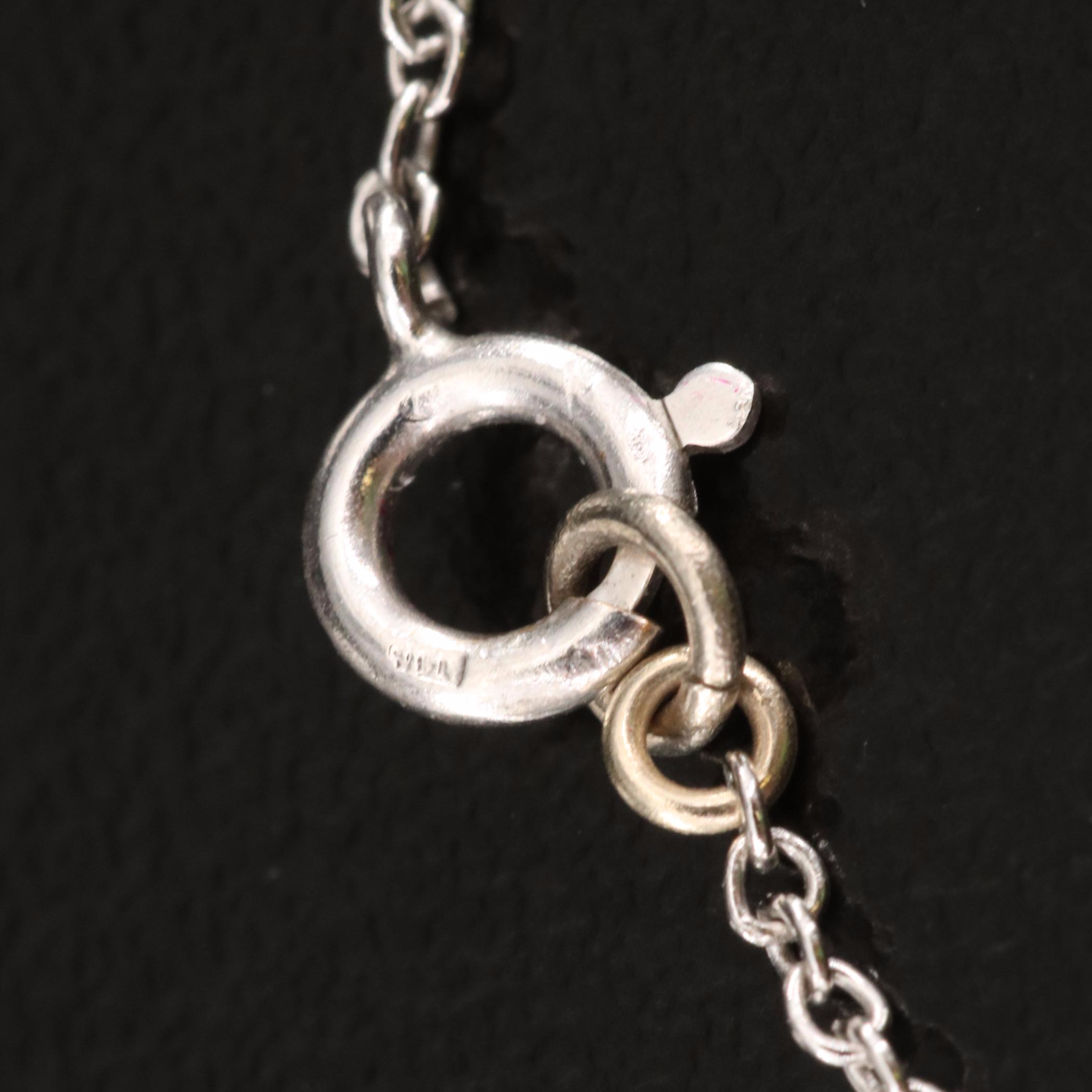 Platinum Ruby and Diamond Star Pendant on 10K Chain