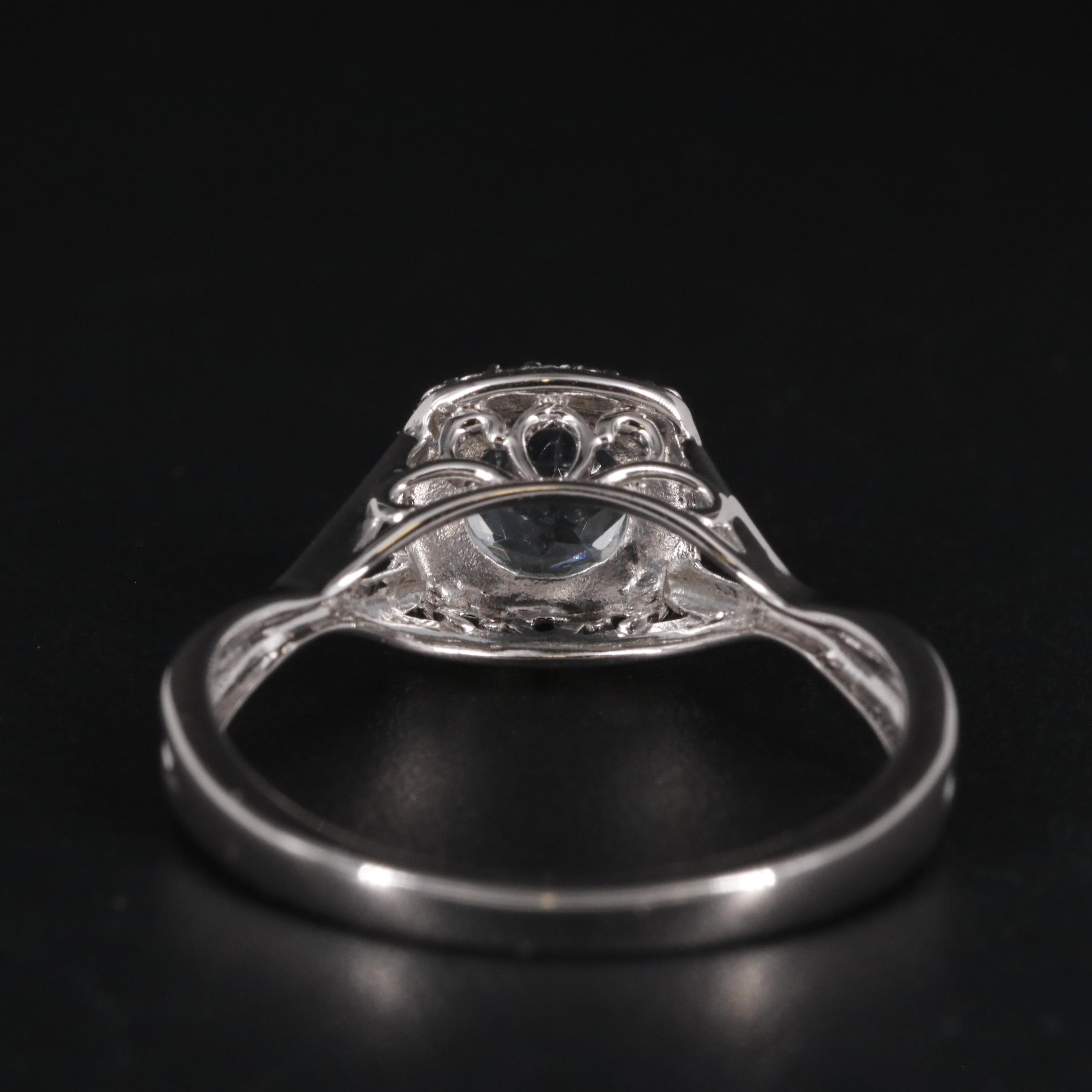 Sterling Topaz and Cubic Zirconia Halo Ring