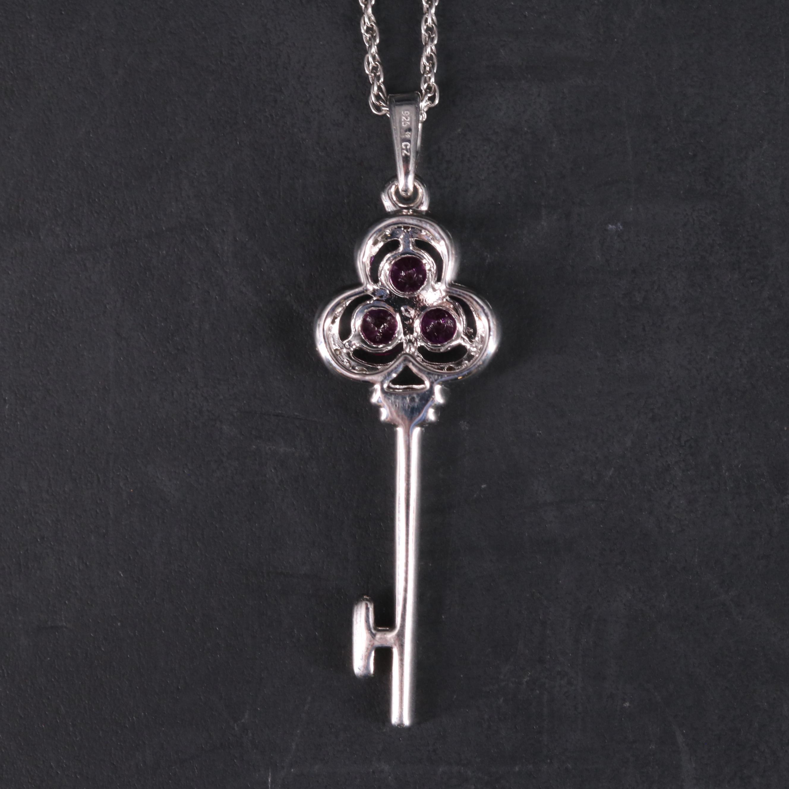 Sterling Silver Ruby and Cubic Zirconia Key Pendant with Stud Earrings