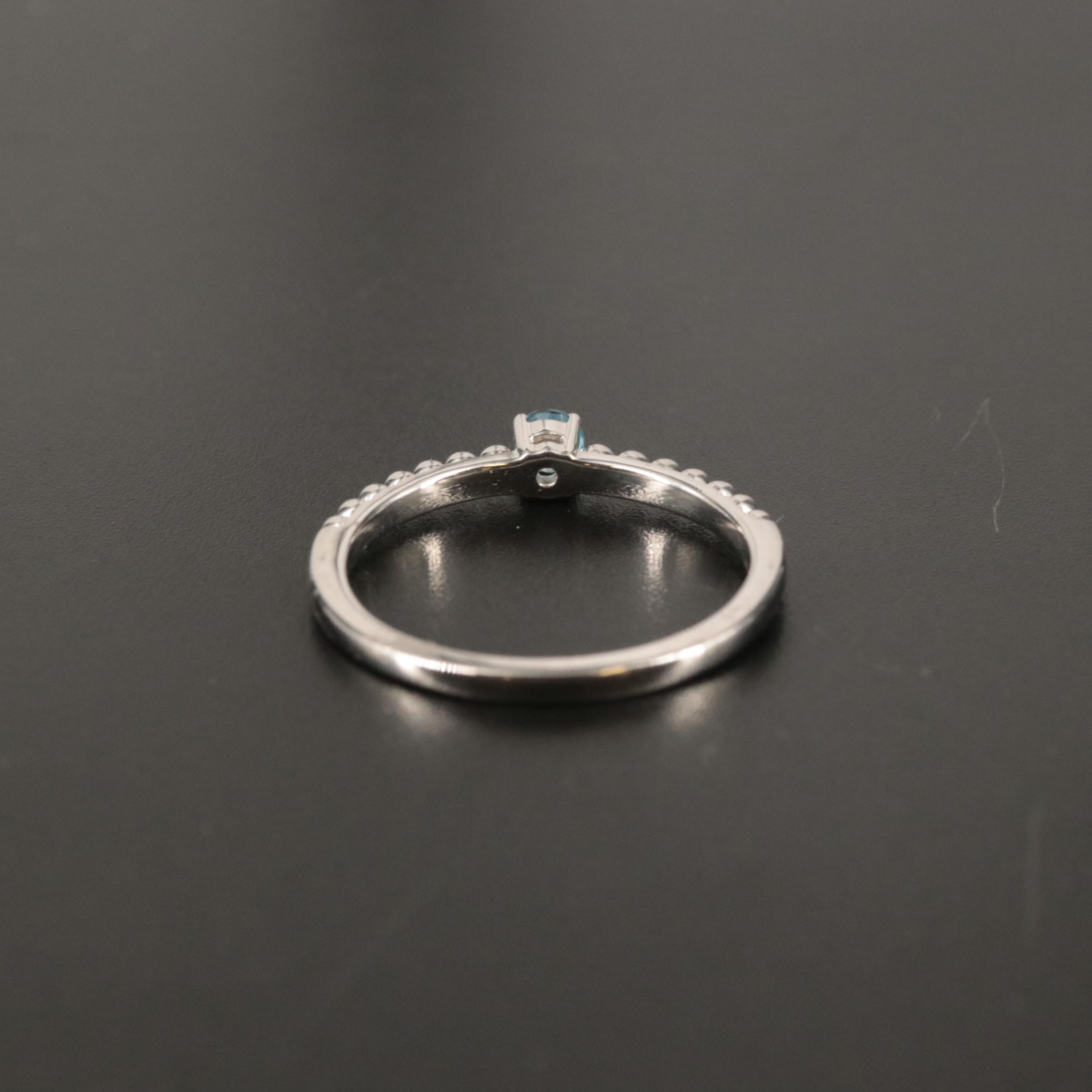 Sterling Topaz Side Stone Ring