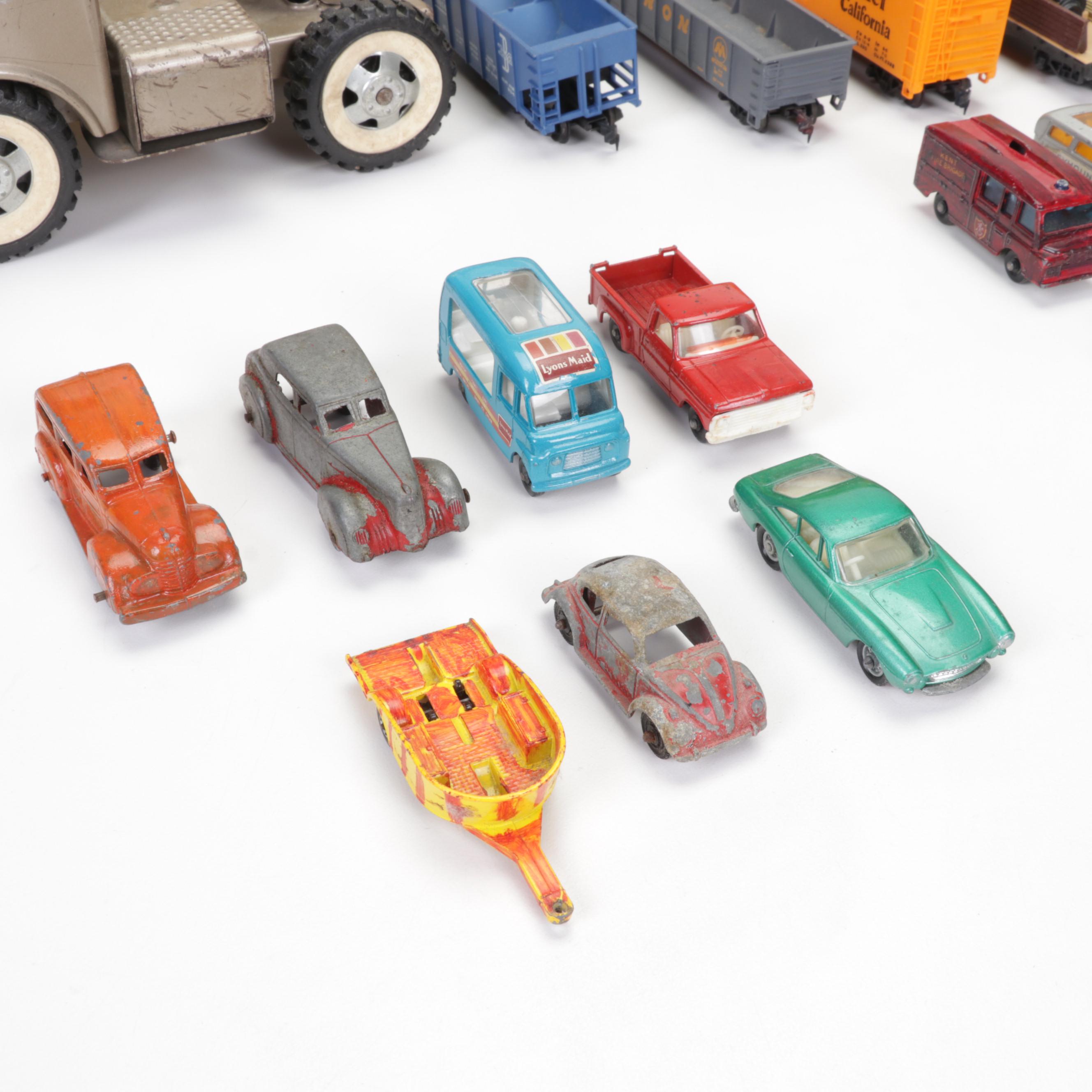 Tonka Car Carrier, Tyco Model Train Cars, and More Toy Vehicles