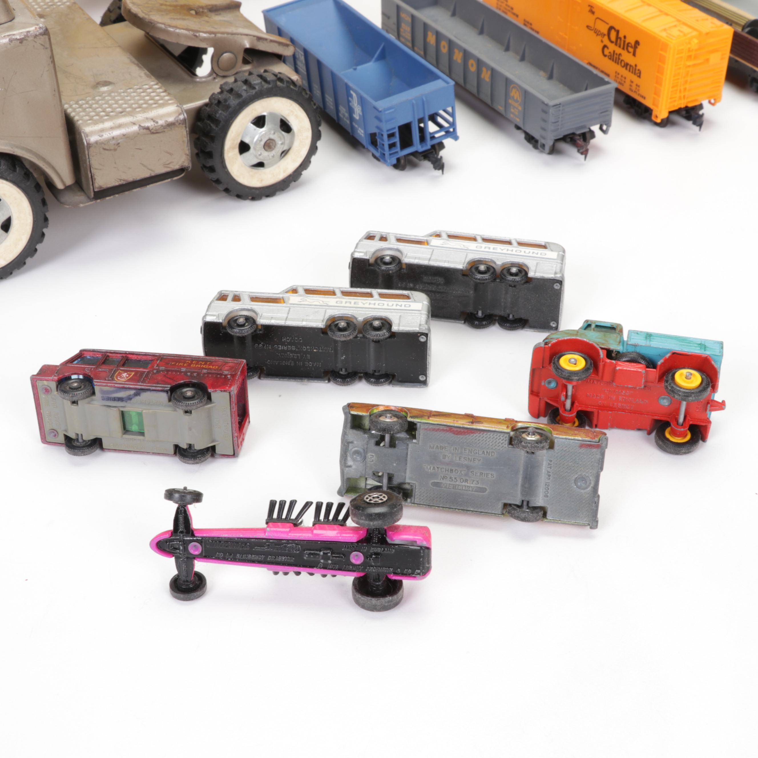 Tonka Car Carrier, Tyco Model Train Cars, and More Toy Vehicles