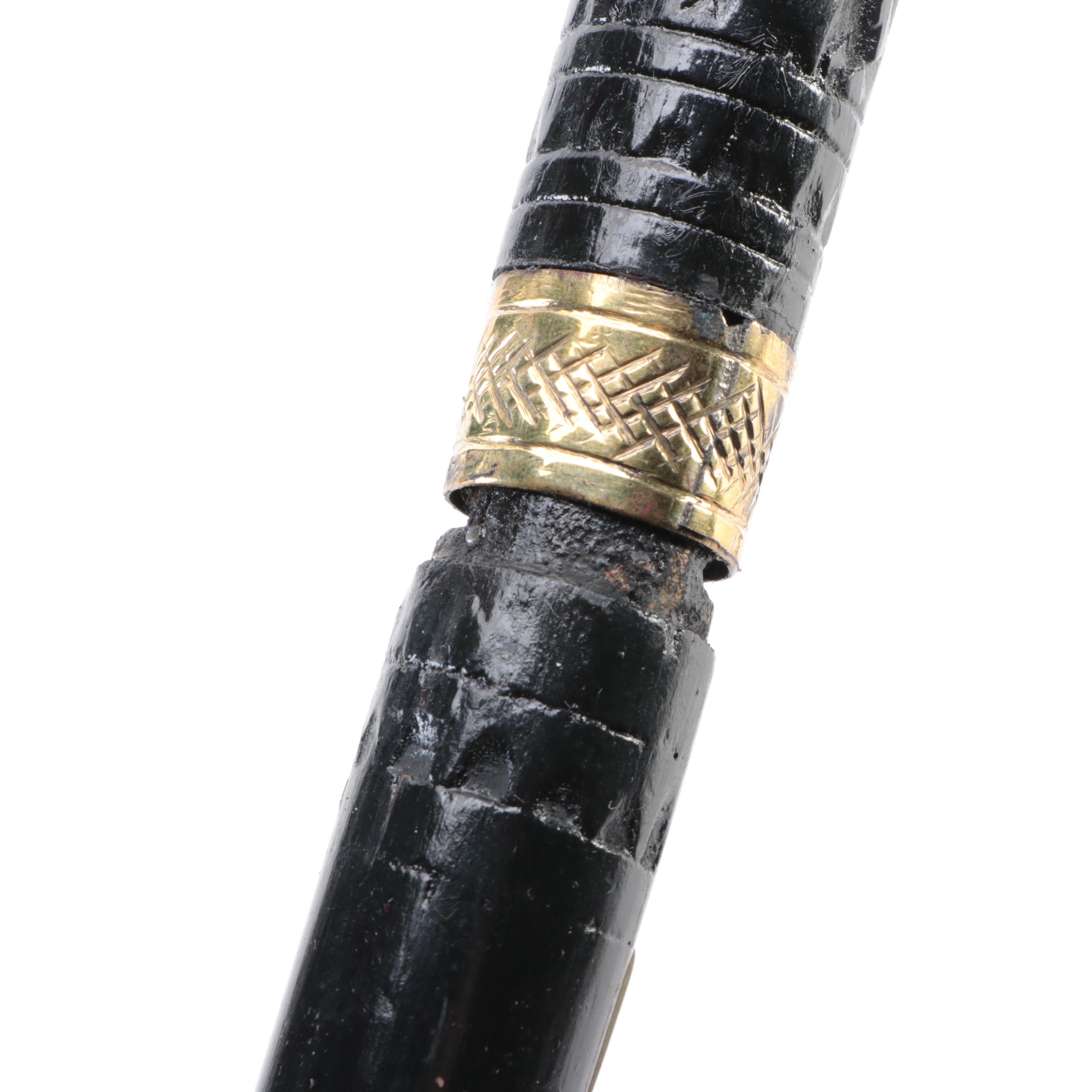 Two Ebonized and Brass Inlaid Sword Canes with Steel Blades