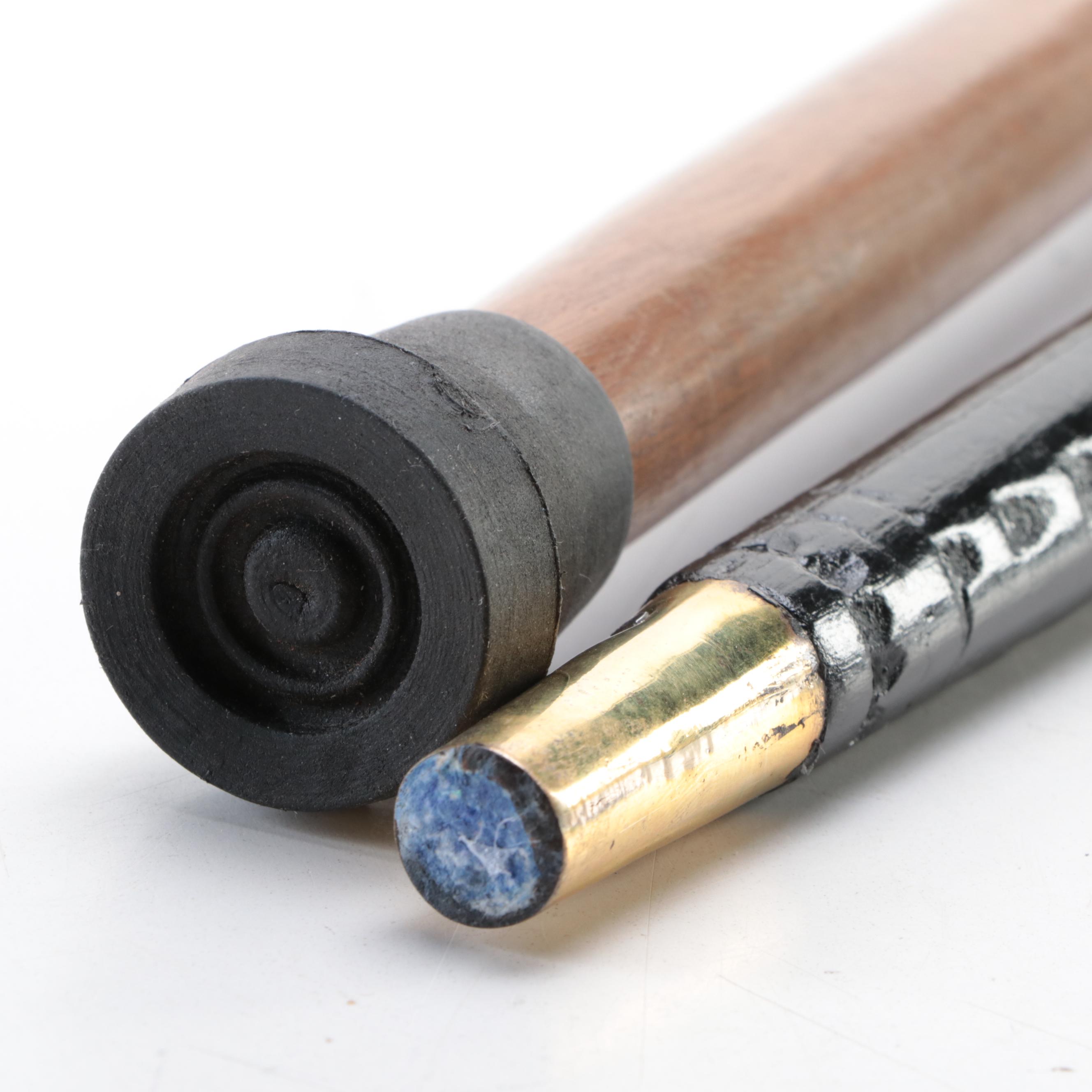 Two Ebonized and Brass Inlaid Sword Canes with Steel Blades