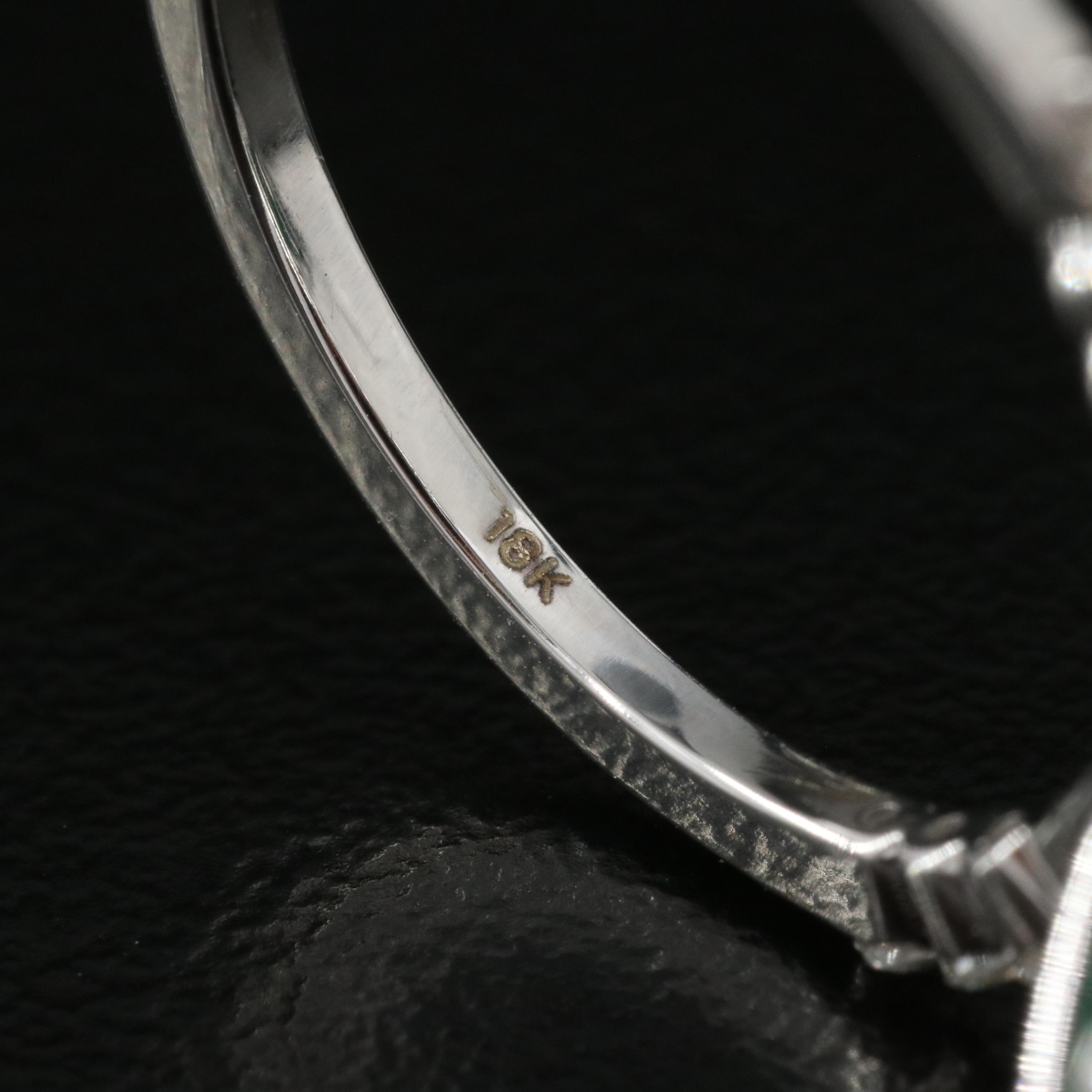 18K 7.62 CT Emerald and Diamond Halo Ring