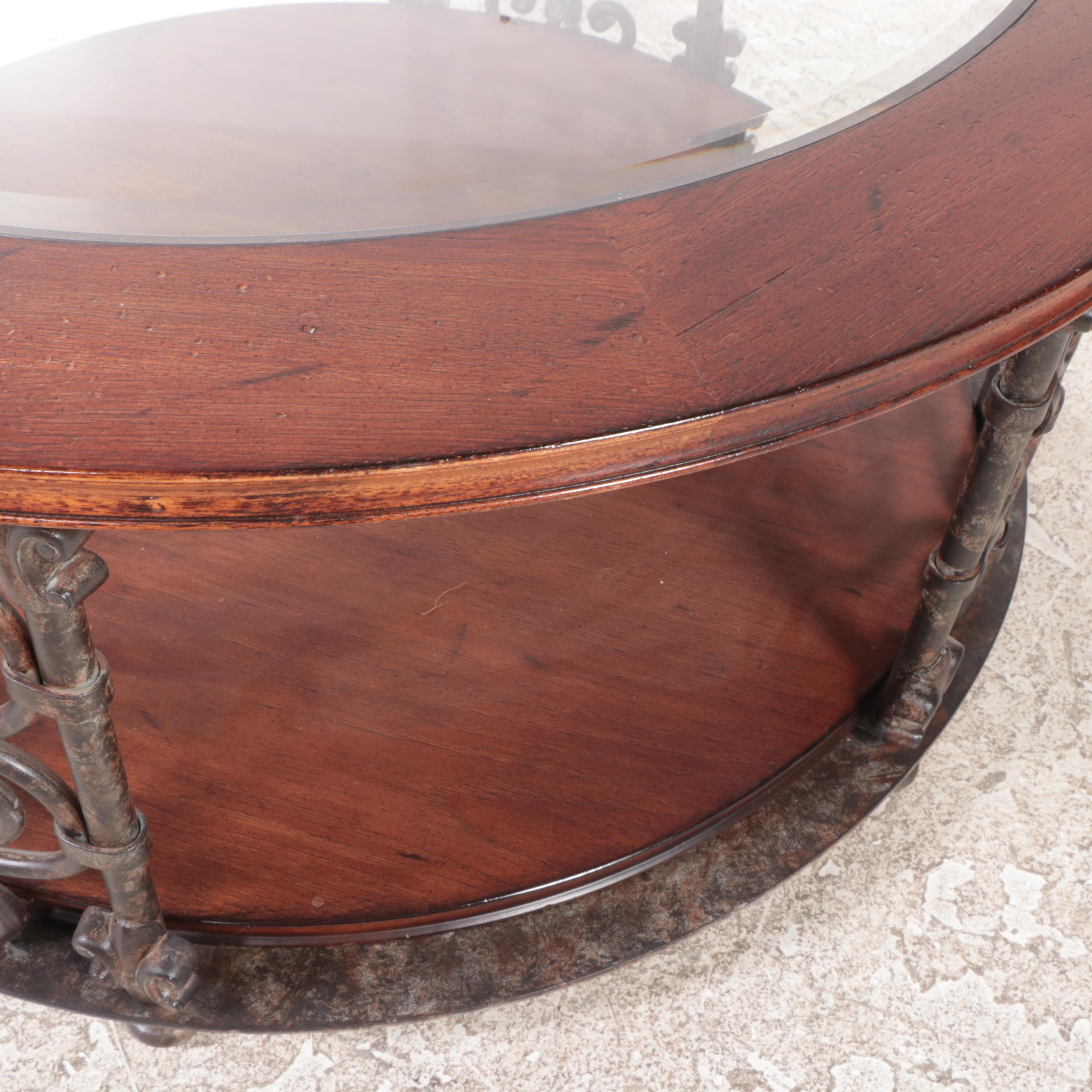 Baroque Style Patinated Iron, Hardwood, and Glass Top Two-Tier Coffee Table