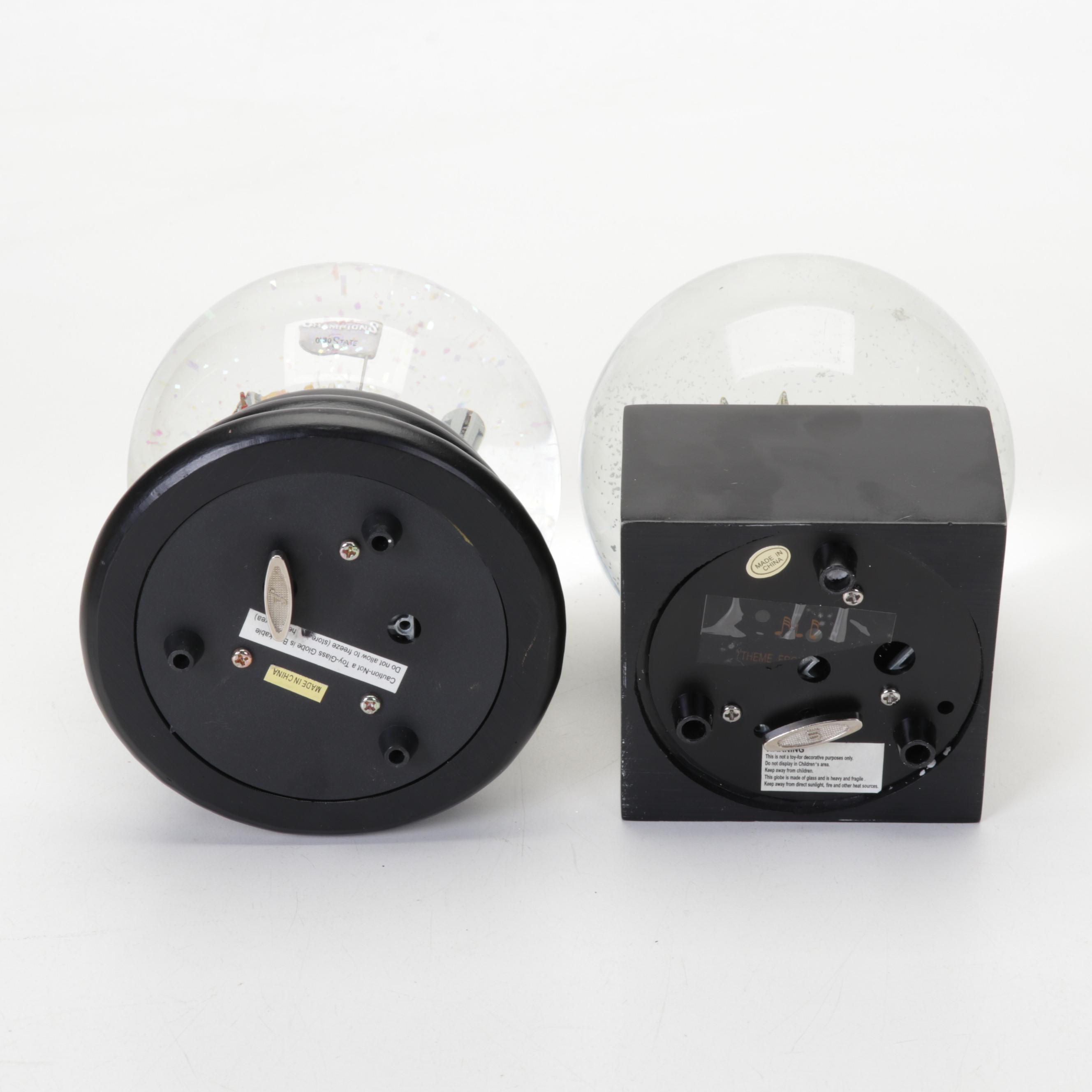 Waterford Crystal, Neiman Marcus, Coach and More Snow Globes