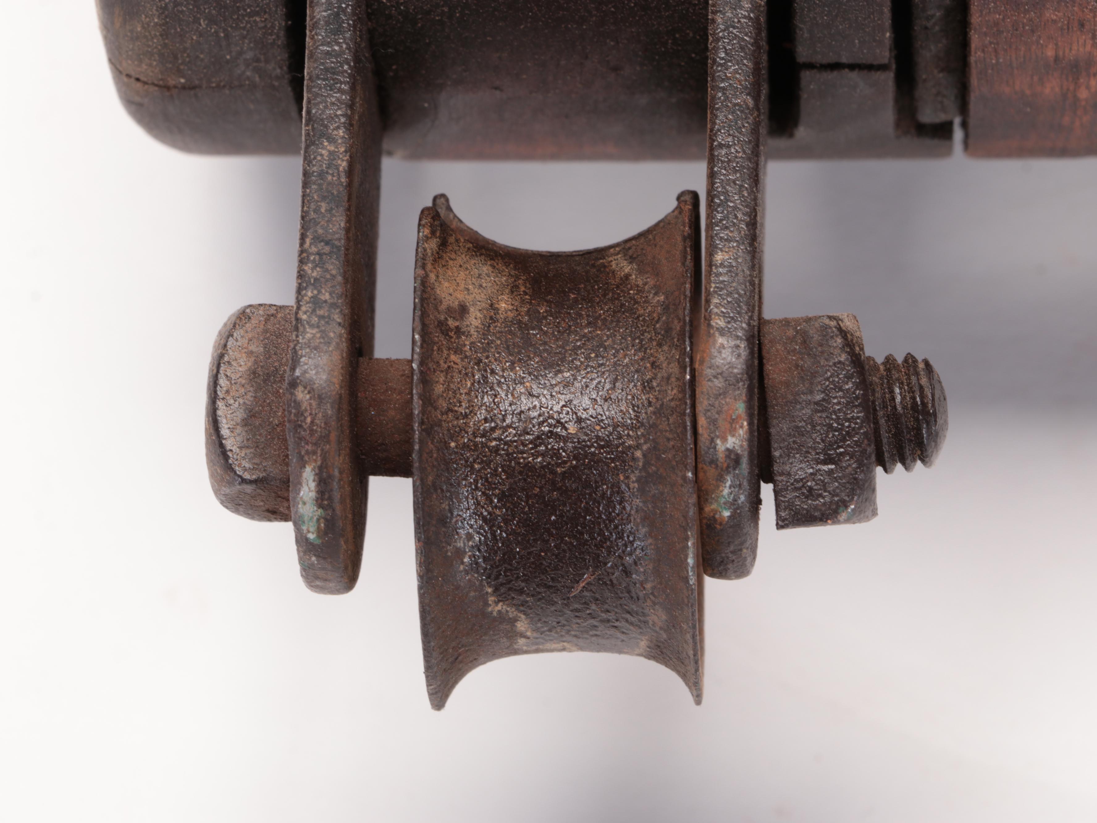 Two Cast Iron and Wood Double Block Pulleys