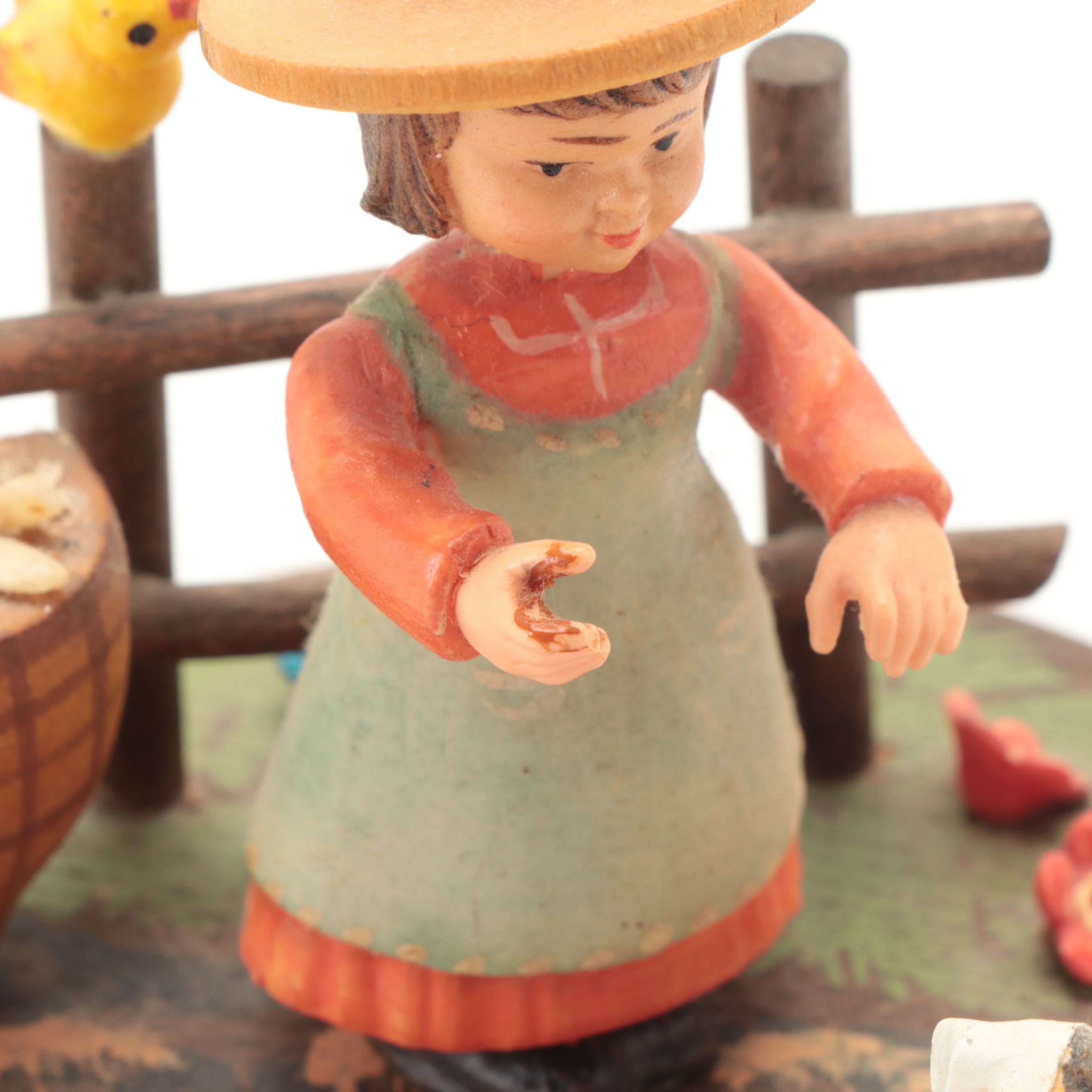 Anri Carved Music Box with Goebel Hummel and Other Porcelain Figurines