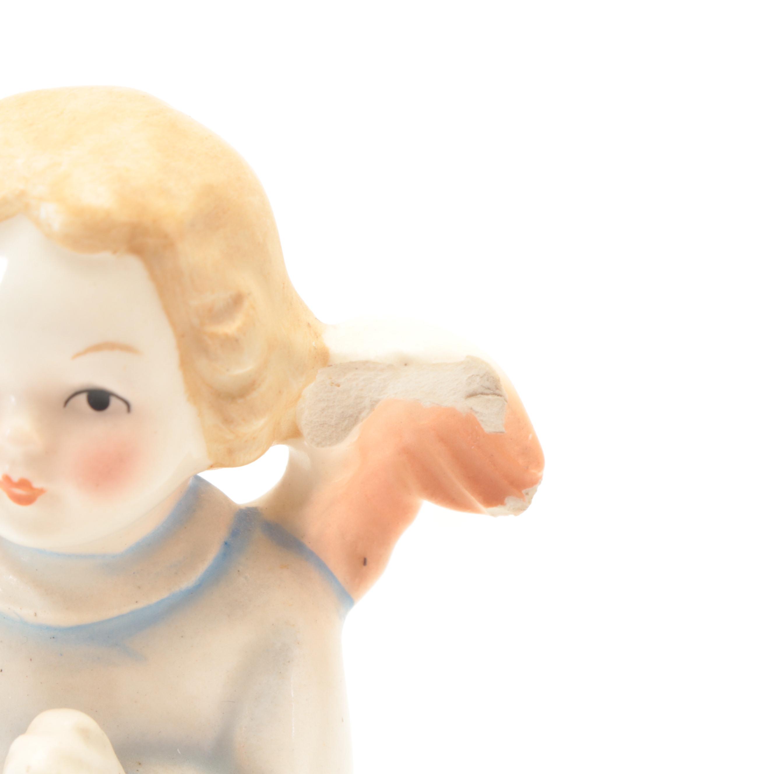 Anri Carved Music Box with Goebel Hummel and Other Porcelain Figurines