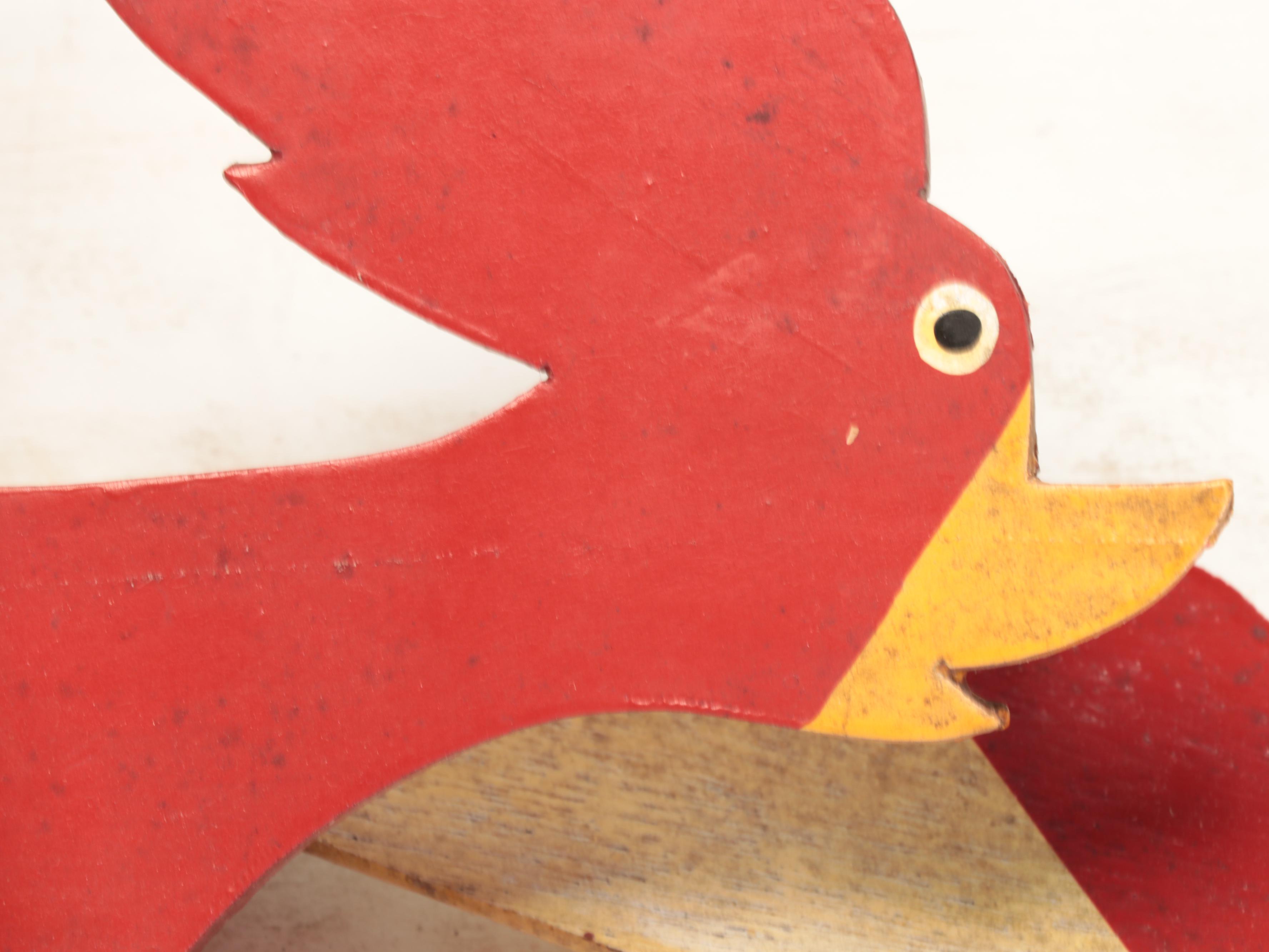 Painted Cutout Metal Dolphins with Kinetic Rooster