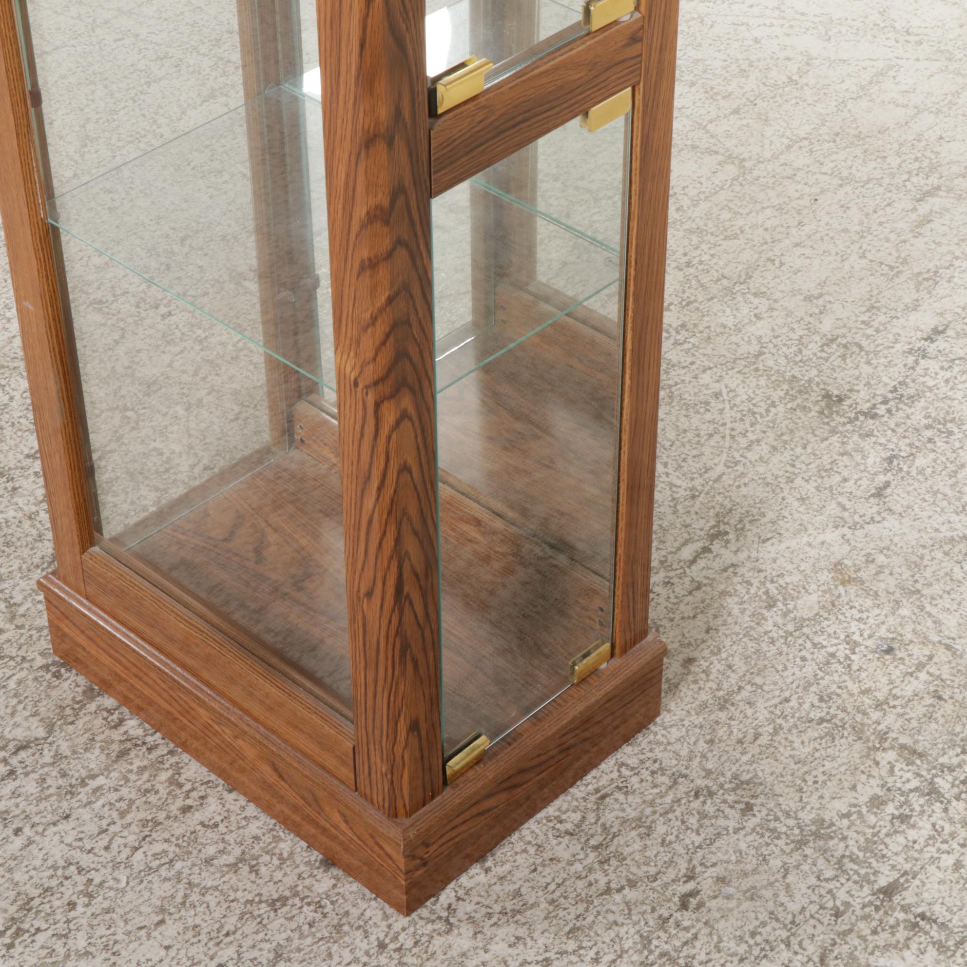 Ashley Furniture Oak-Grained Illuminated Curio Cabinet