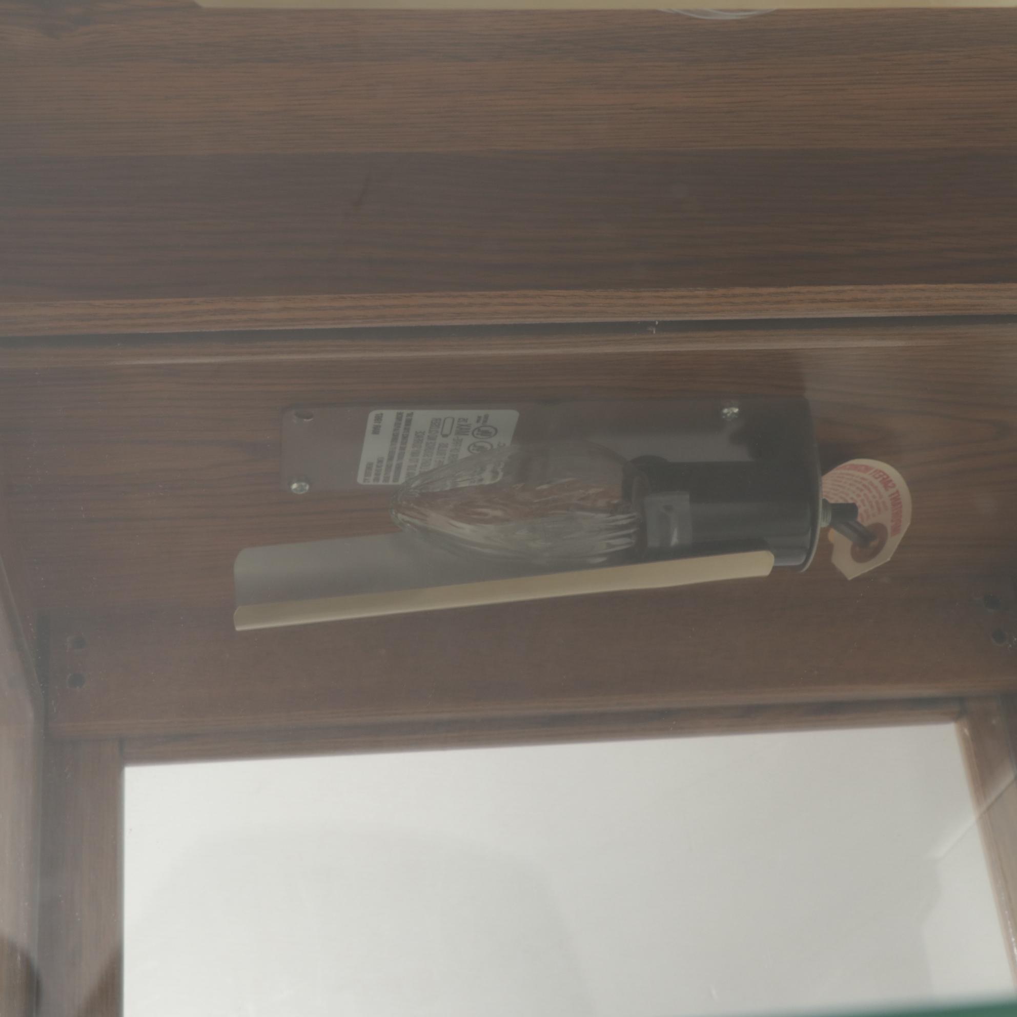 Ashley Furniture Oak-Grained Illuminated Curio Cabinet