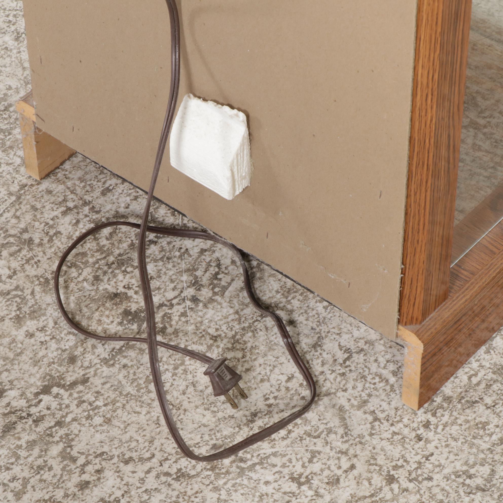 Ashley Furniture Oak-Grained Illuminated Curio Cabinet