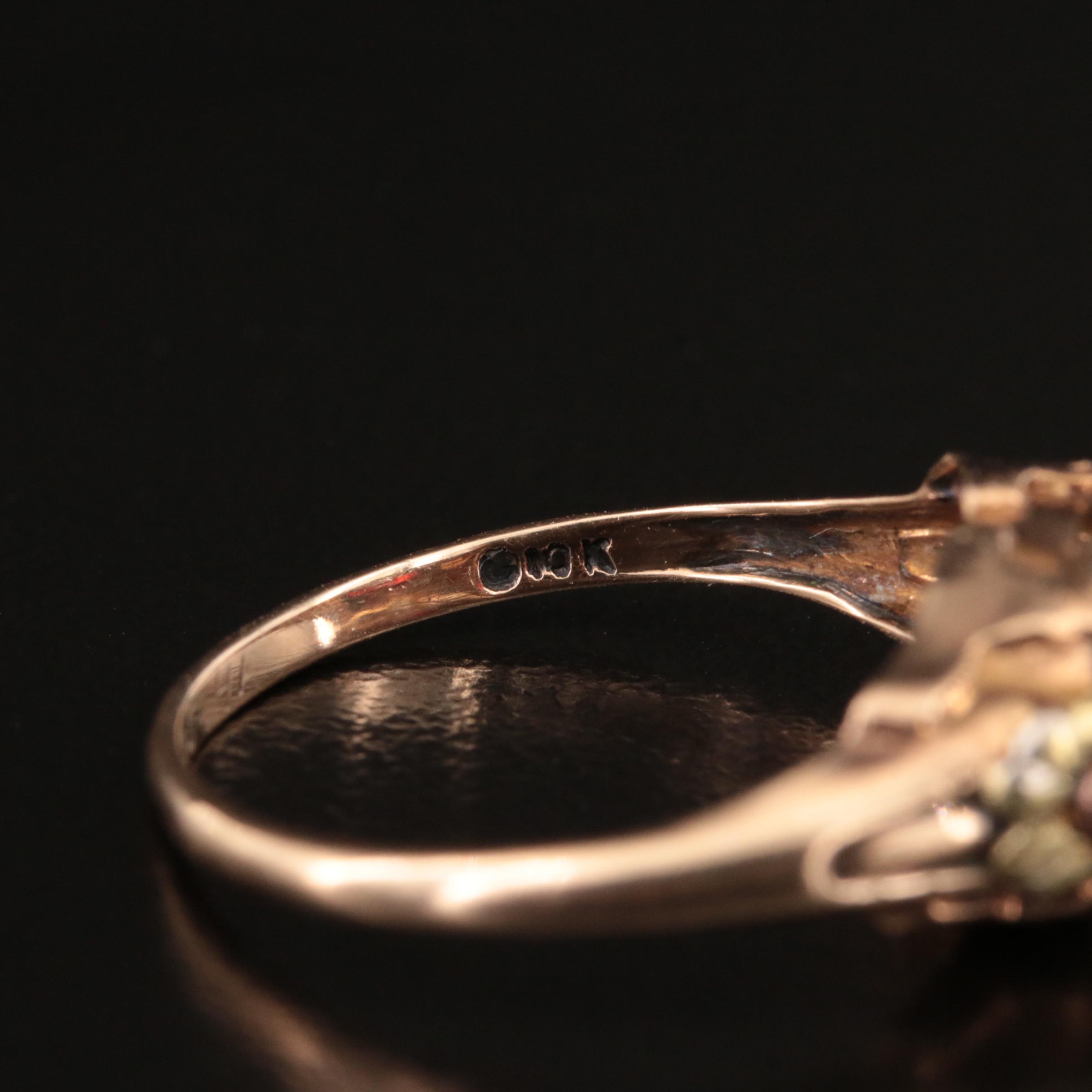 1930s 10K Garnet Ring with Green and Rose Gold Flower Accents